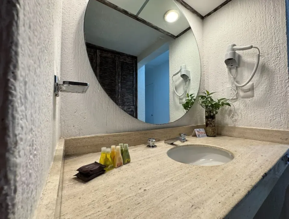 Junior Suite Sea View bathroom vanity at All Ritmo Cancun Resort & Water Park.