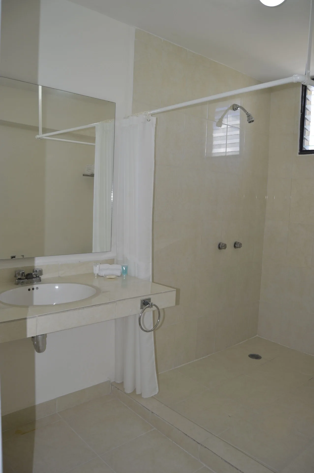 Master Suite Garden View bathroom with shower at All Ritmo Cancun Resort & Water Park.