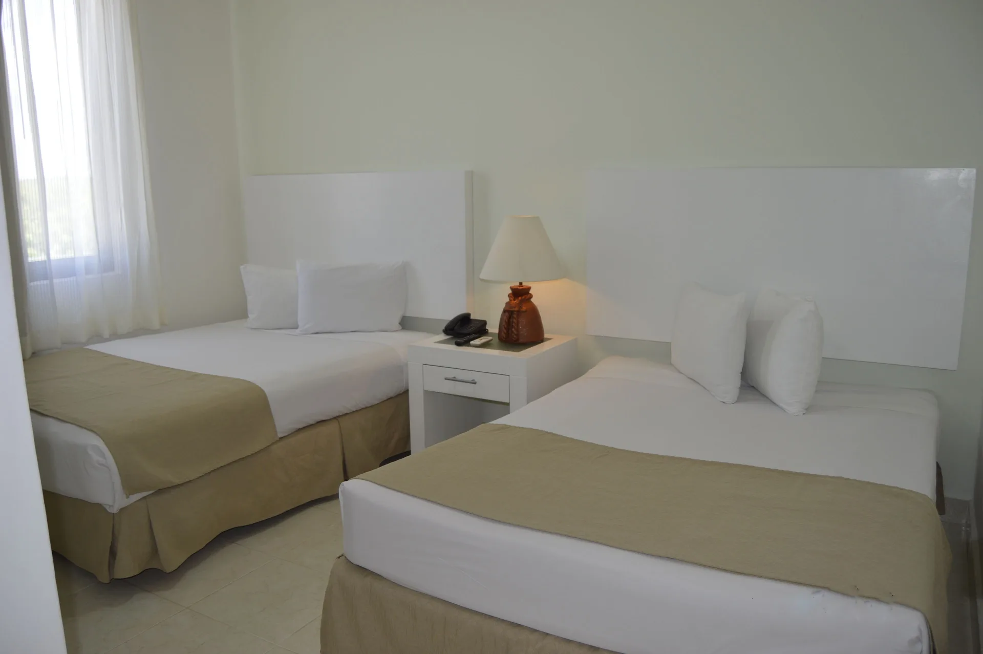 Master Suite Garden View twin bedroom at All Ritmo Cancun Resort & Water Park.