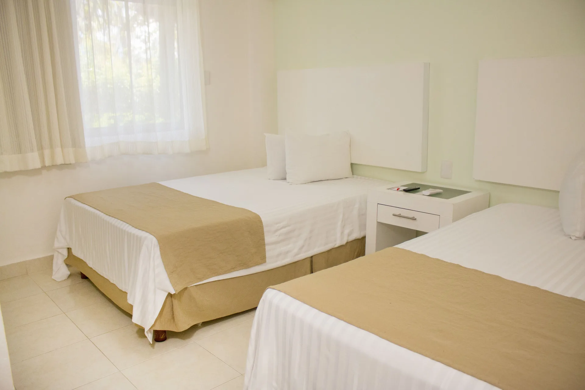 Two double beds in a Master Suite Garden View room at All Ritmo Cancun Resort & Water Park.