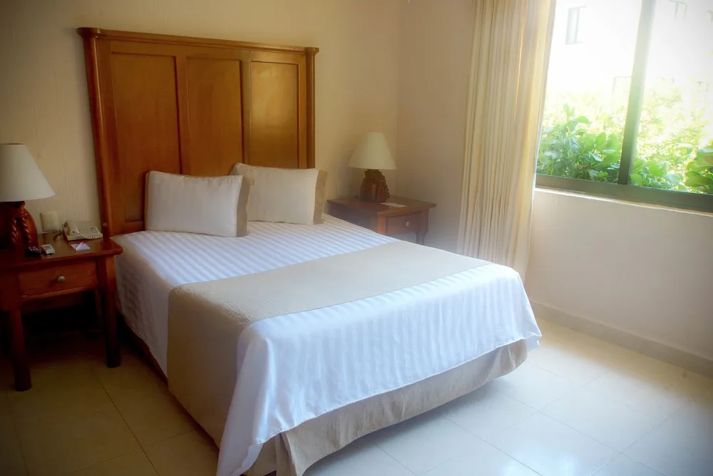 Standard Room with one bed and window at All Ritmo Cancun Resort & Water Park.