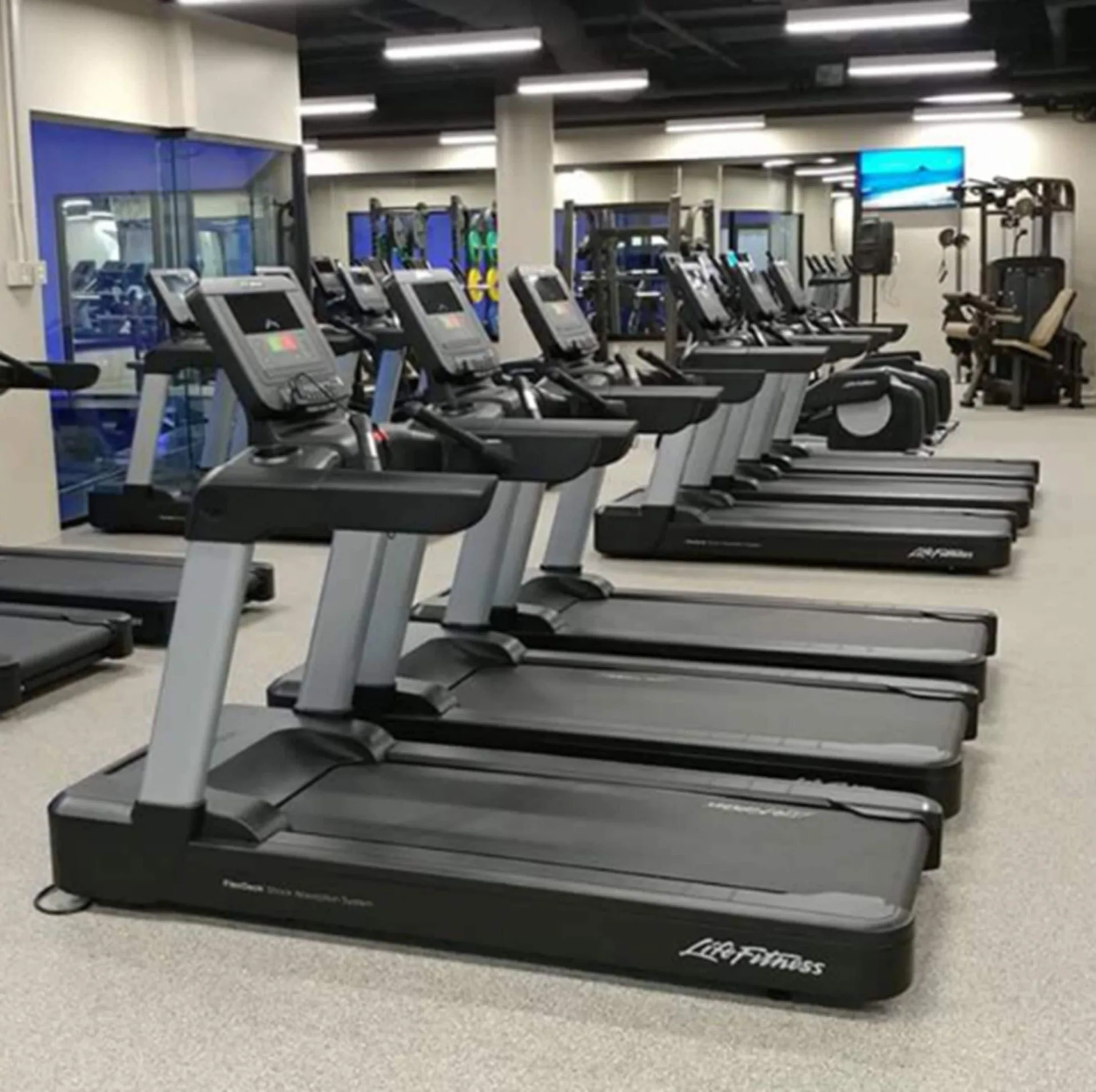 Fitness center treadmills and strength equipment at 'Alohilani Resort Waikiki Beach.