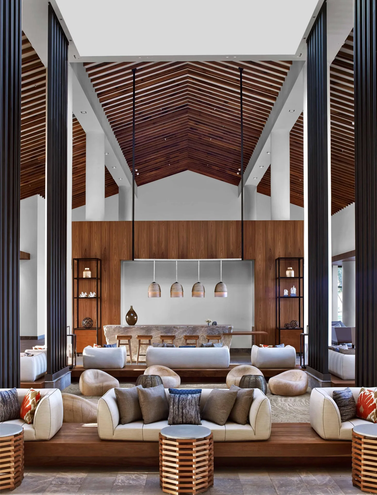 Lobby bar and seating under a peaked wood ceiling at Andaz Maui at Wailea Resort.