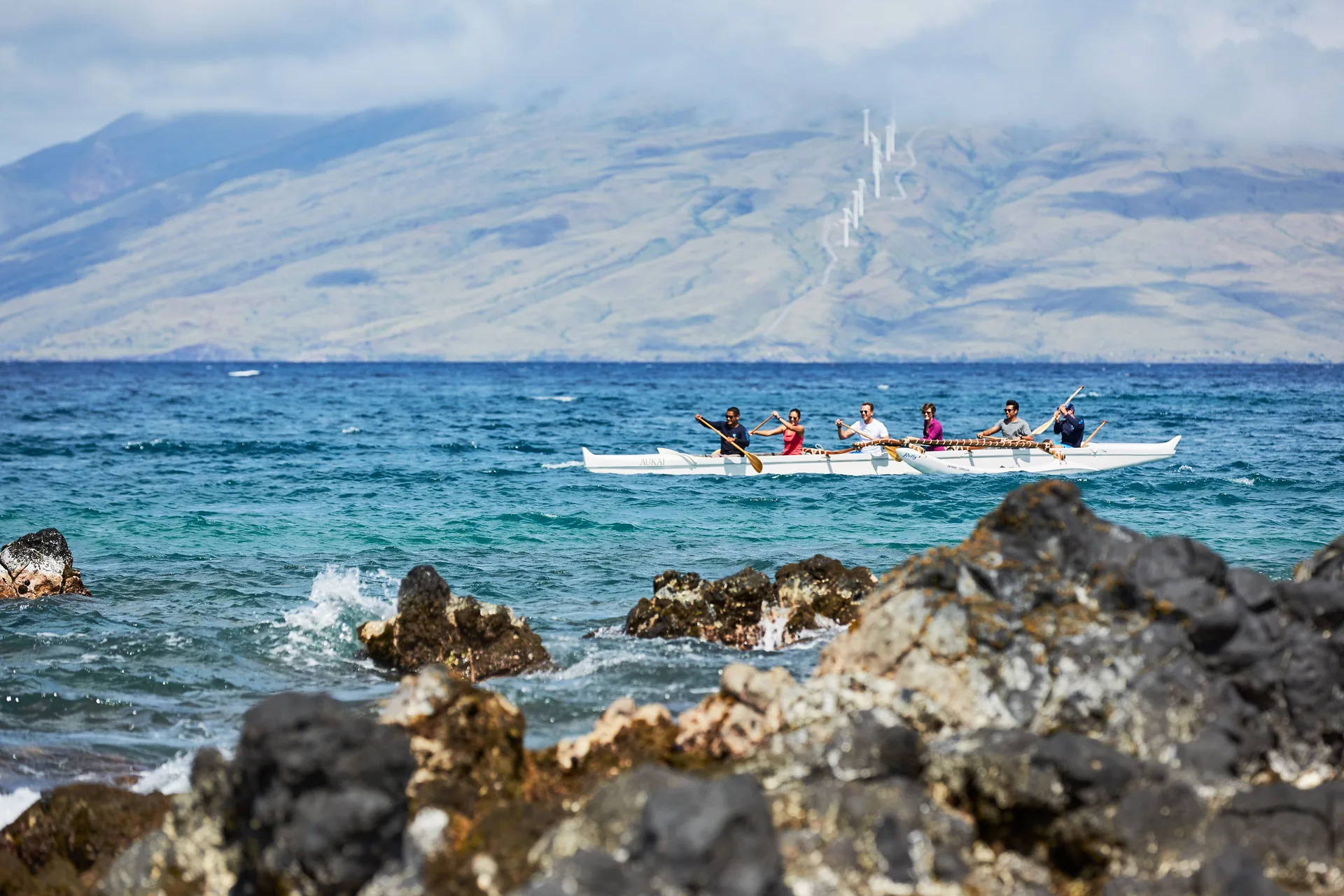 Outrigger canoe on the ocean near Andaz Maui at Wailea Resort.
