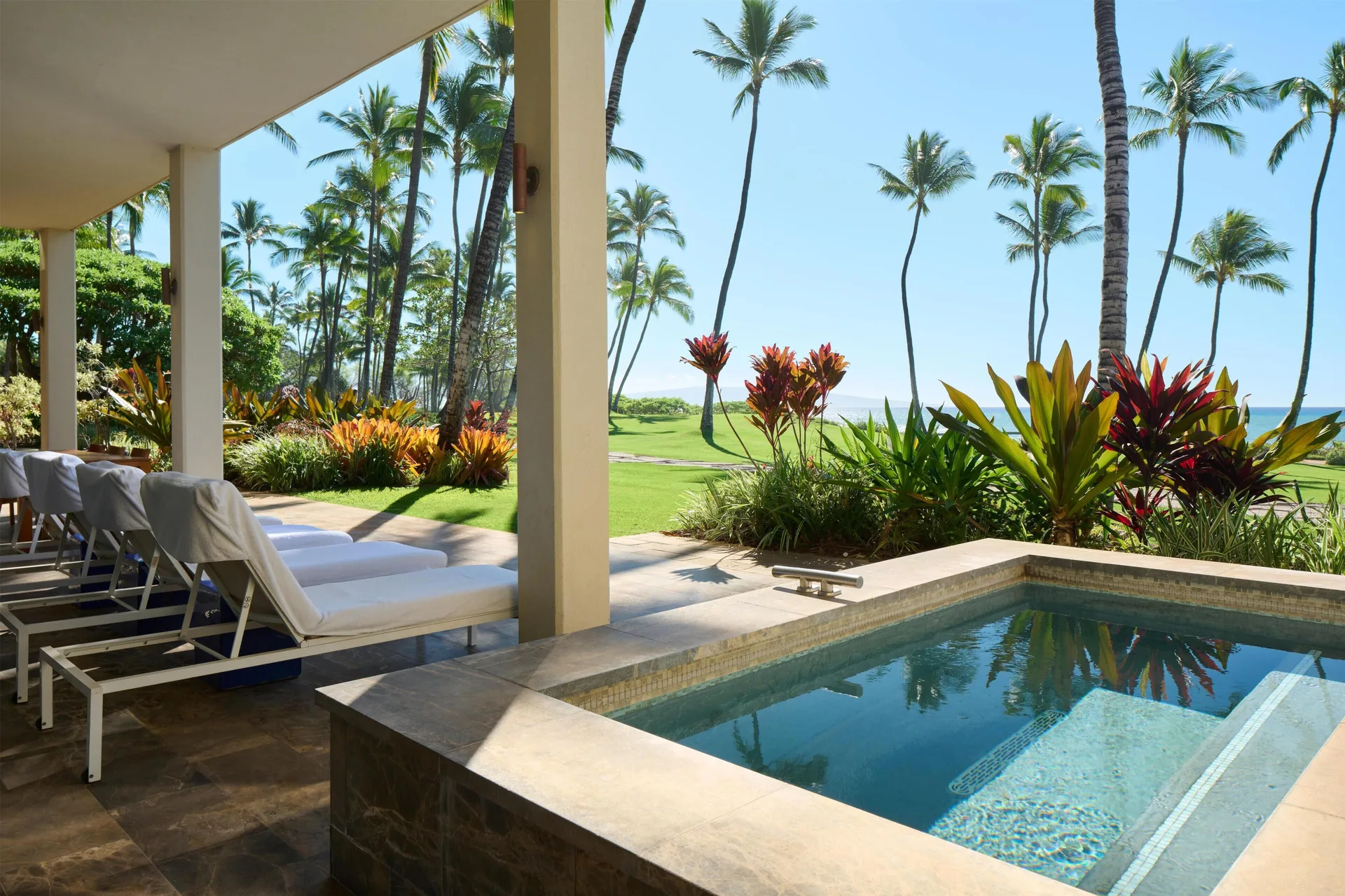 Private plunge pool terrace with loungers, palms, and ocean view at Andaz Maui at Wailea Resort.