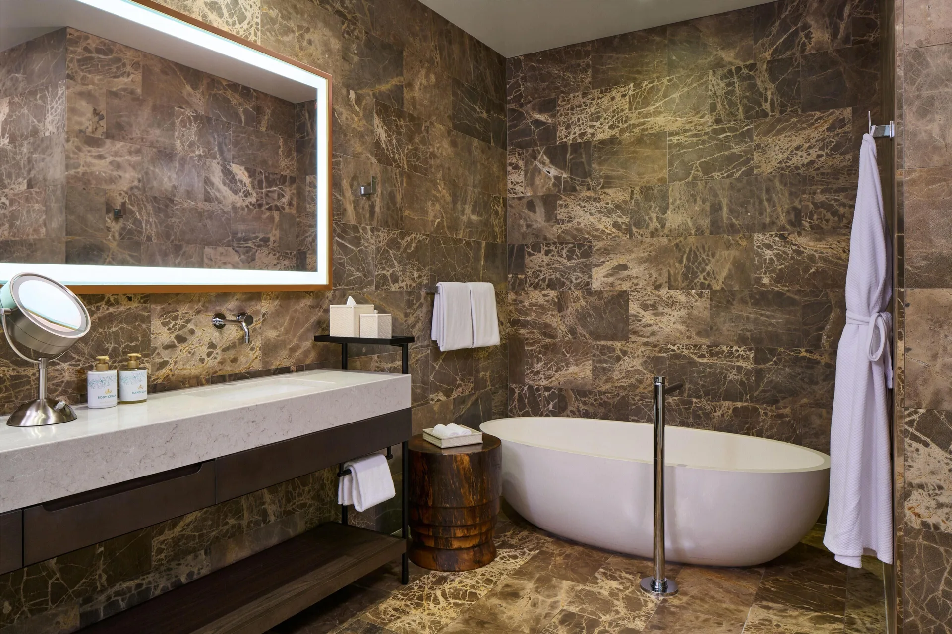 Bathroom with soaking tub and vanity in a villa at Andaz Maui at Wailea Resort.