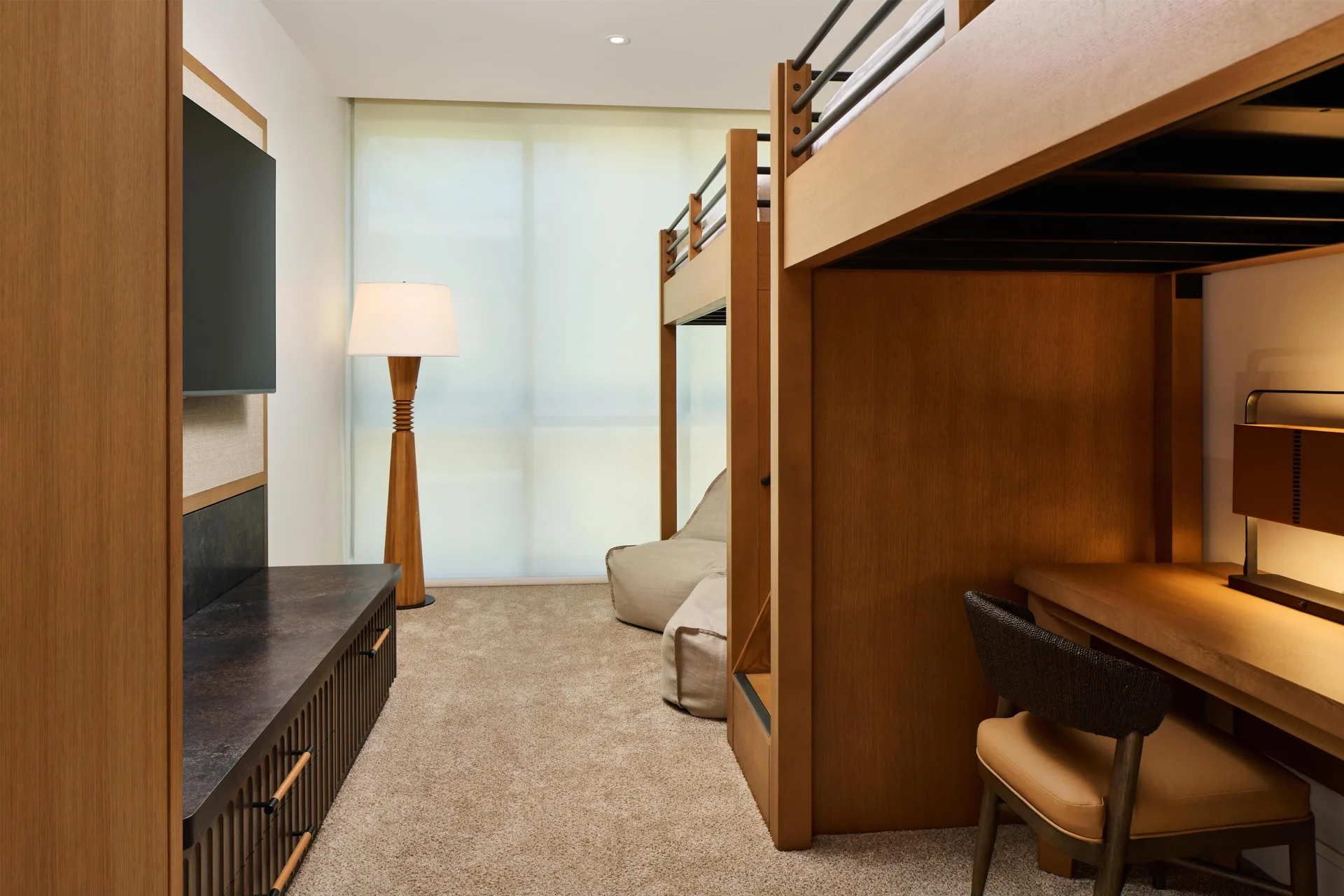 Bunk room with desk and TV in a villa at Andaz Maui at Wailea Resort.