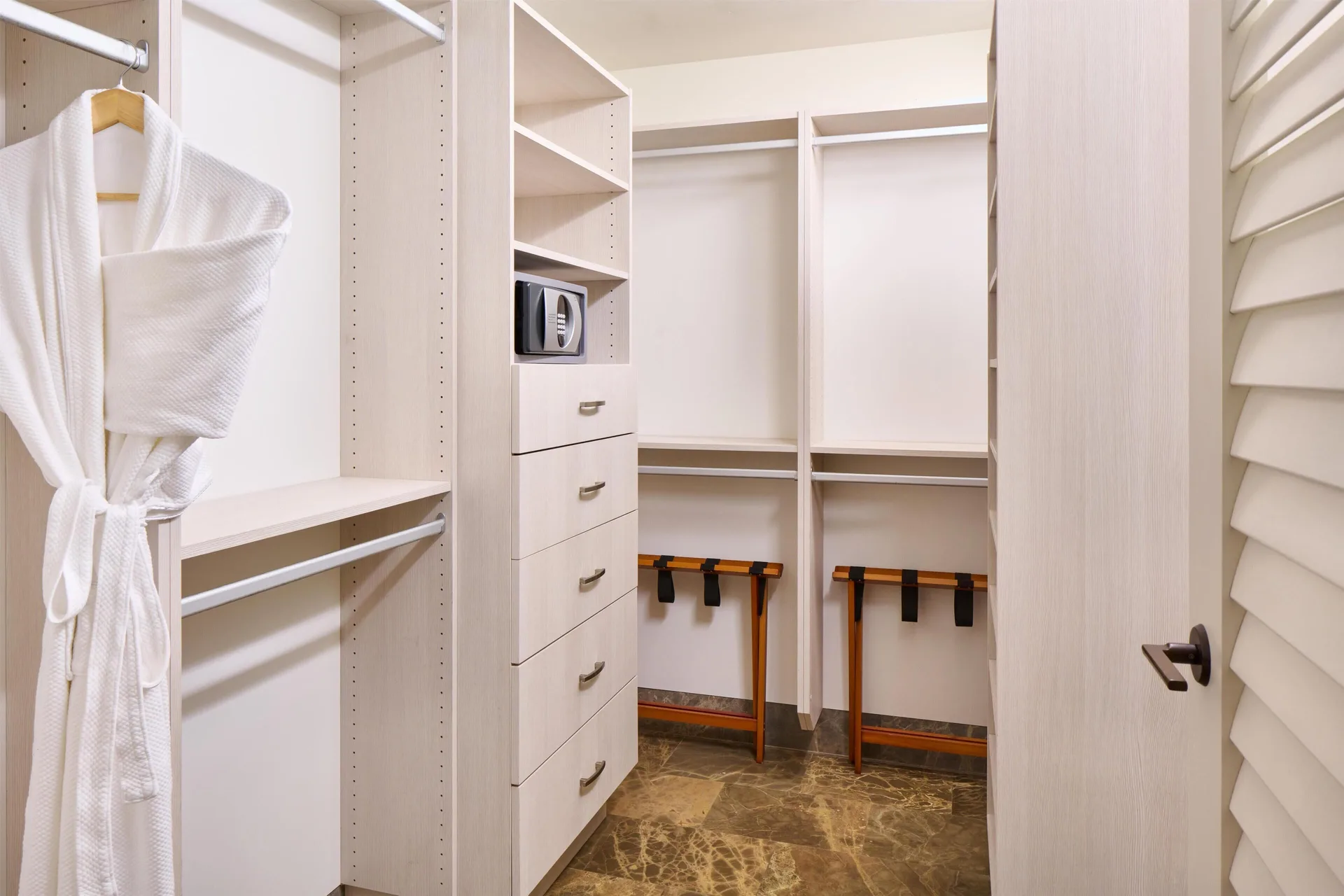 Walk-in closet with robe and safe in a villa at Andaz Maui at Wailea Resort.