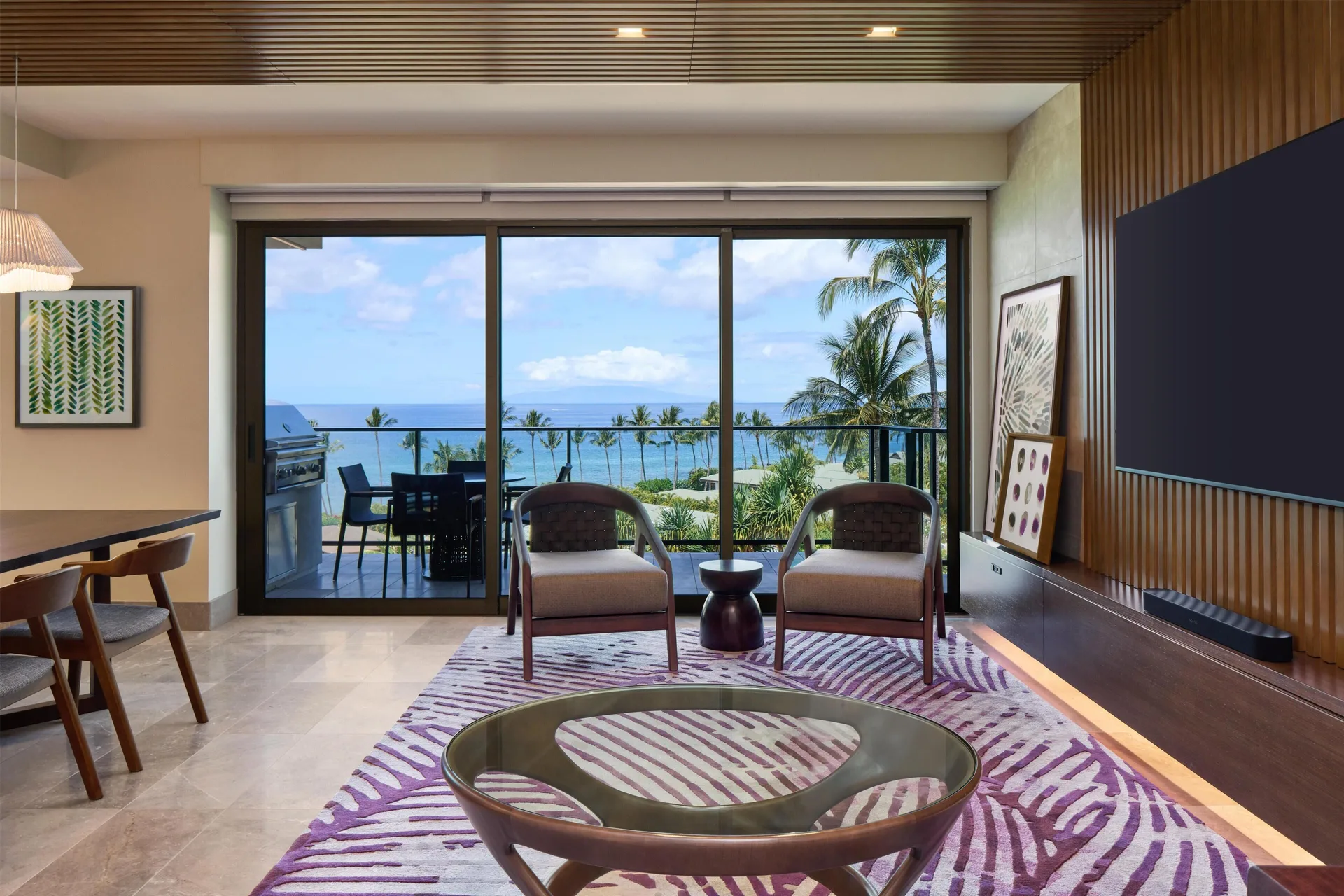 Ocean-view villa living room with balcony seating at Andaz Maui at Wailea Resort.