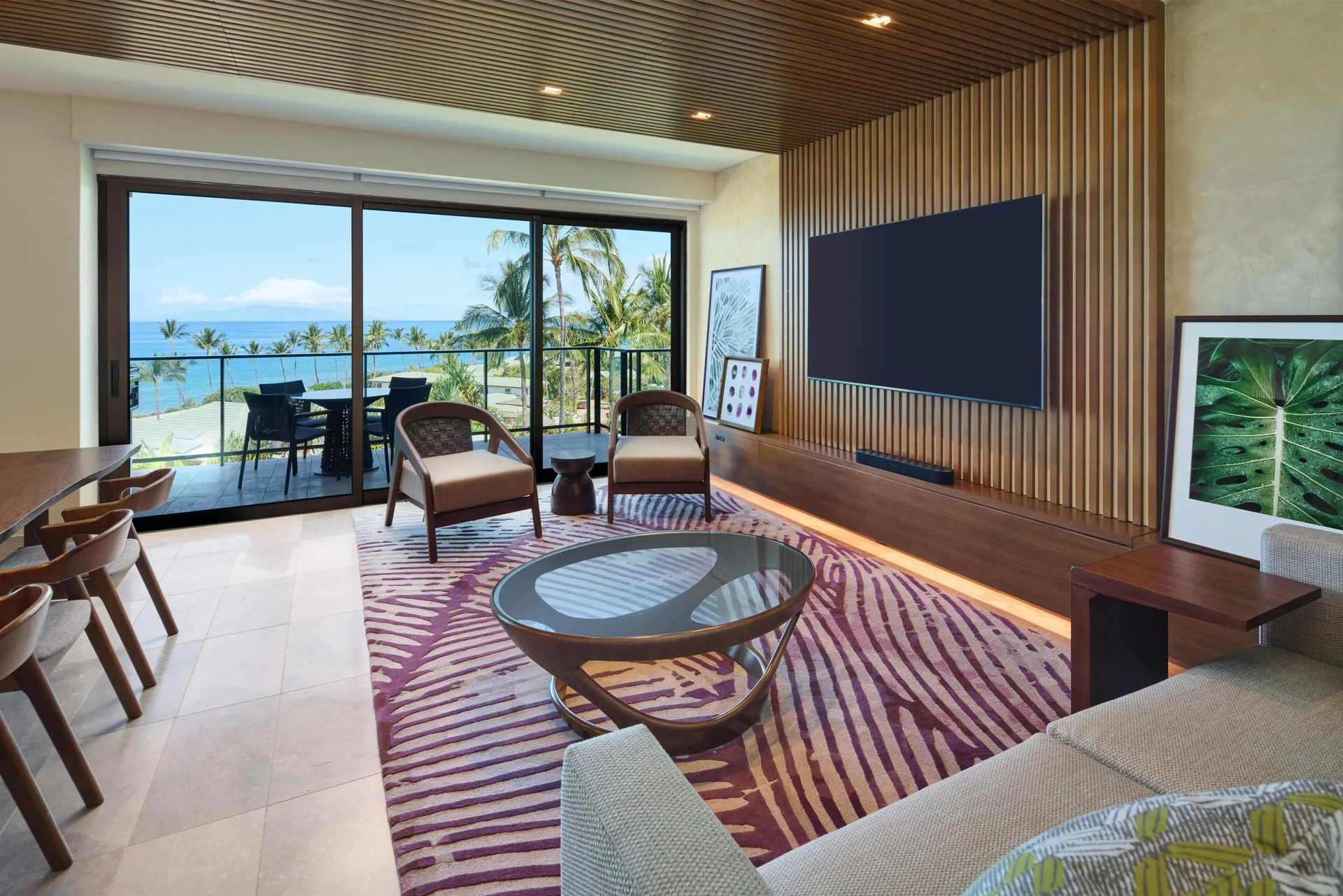 Ocean-view villa lounge with sofa, TV, and balcony at Andaz Maui at Wailea Resort.