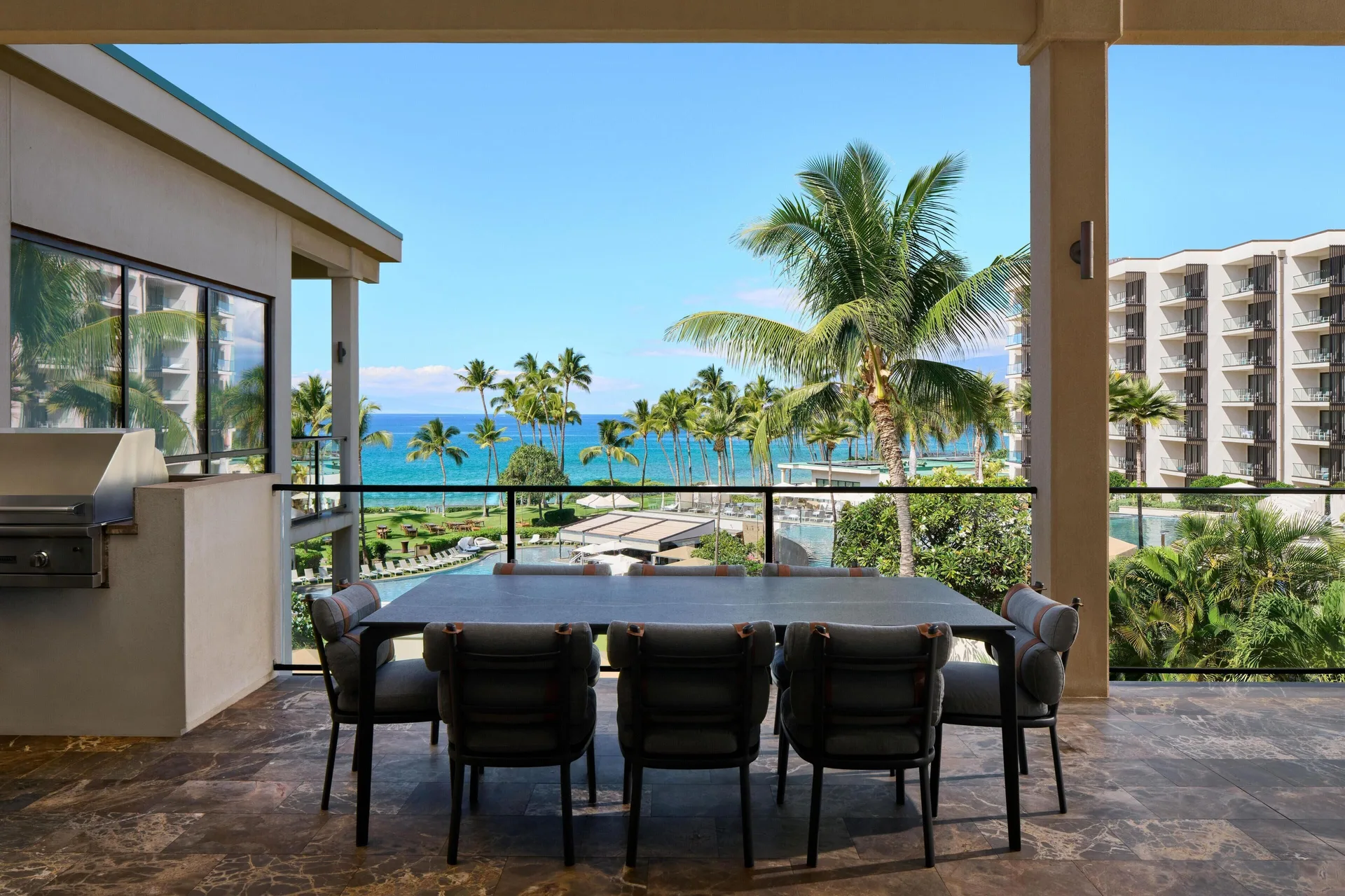 Ocean-view villa lanai with dining table and grill at Andaz Maui at Wailea Resort.