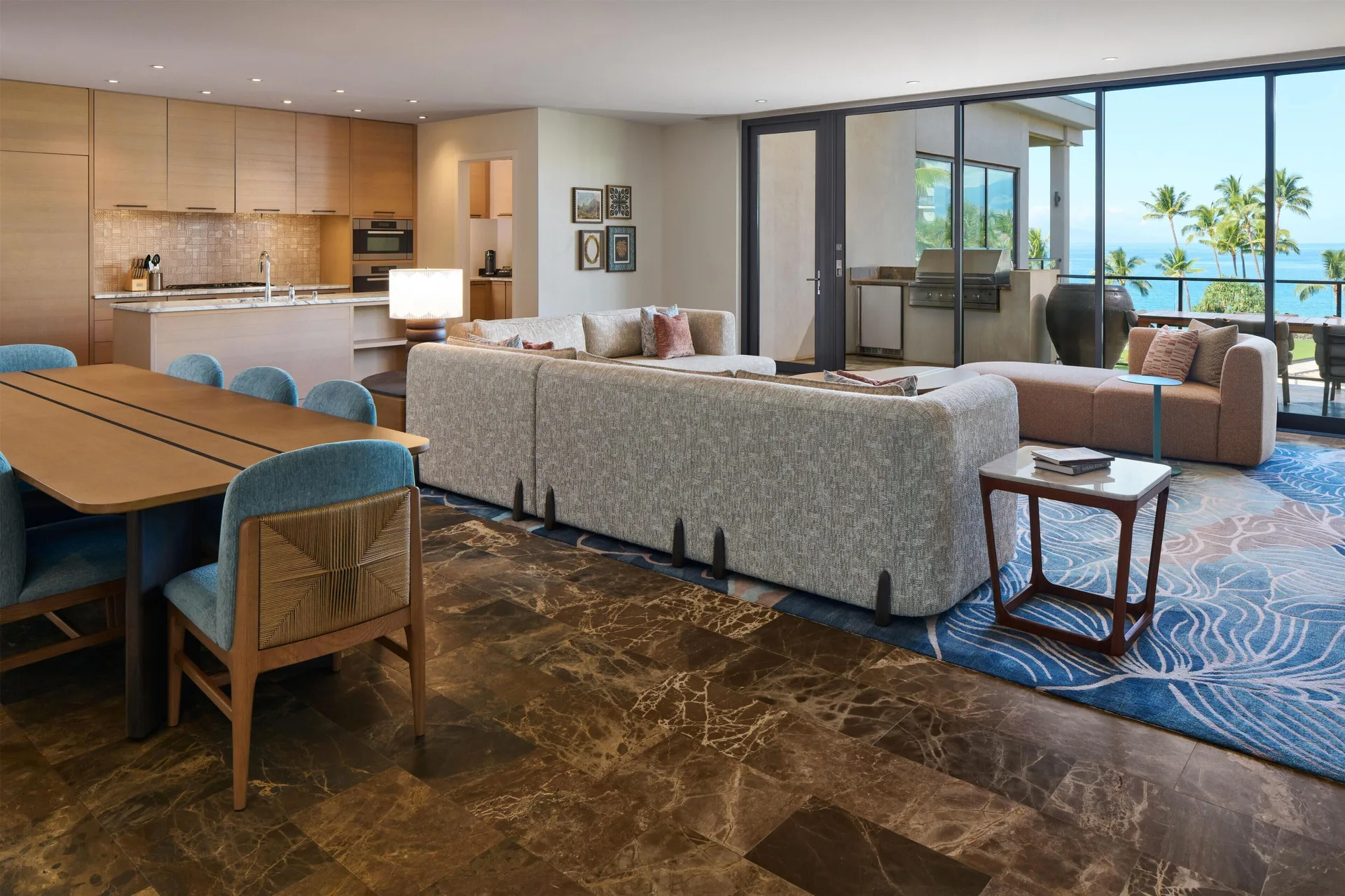 Villa living room, dining table, kitchen, and ocean-view lanai at Andaz Maui at Wailea Resort.