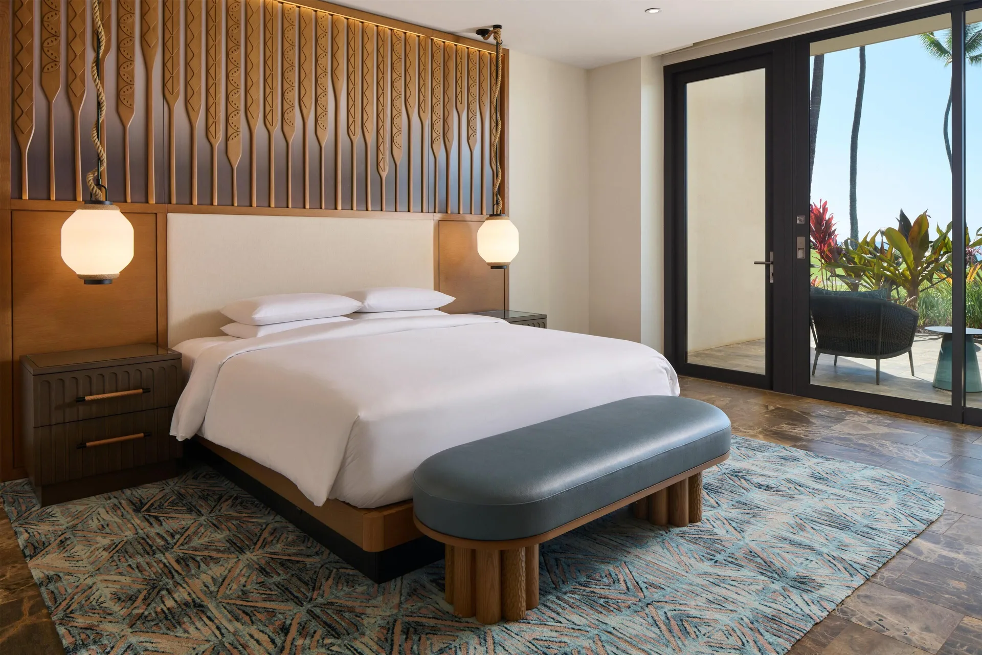 Oceanfront villa king bedroom with patio doors at Andaz Maui at Wailea Resort.