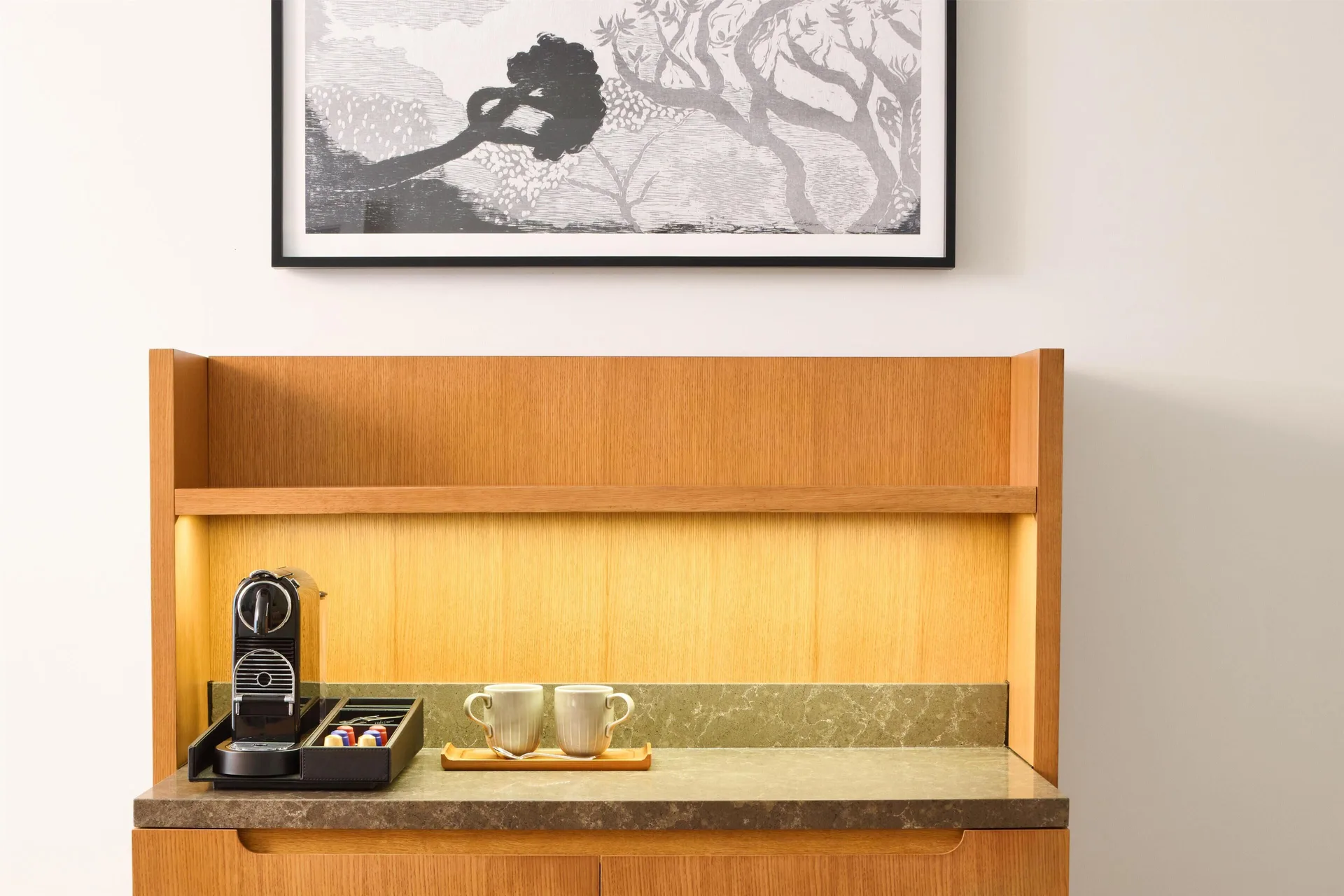 Ocean View Suite coffee station with cups and framed art at Andaz Maui at Wailea Resort.