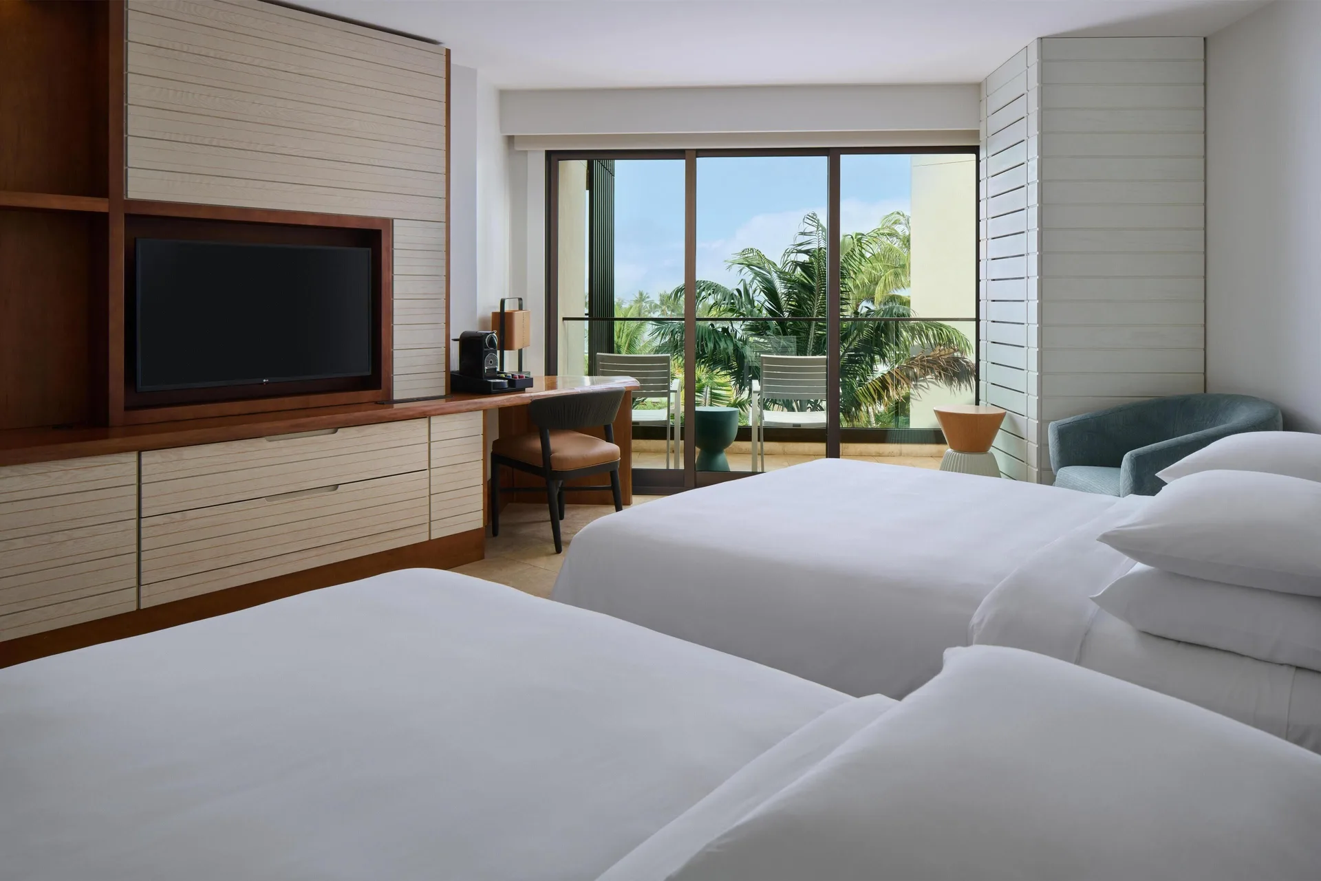 Partial Ocean View room with two beds and a balcony overlooking palms at Andaz Maui at Wailea Resort.