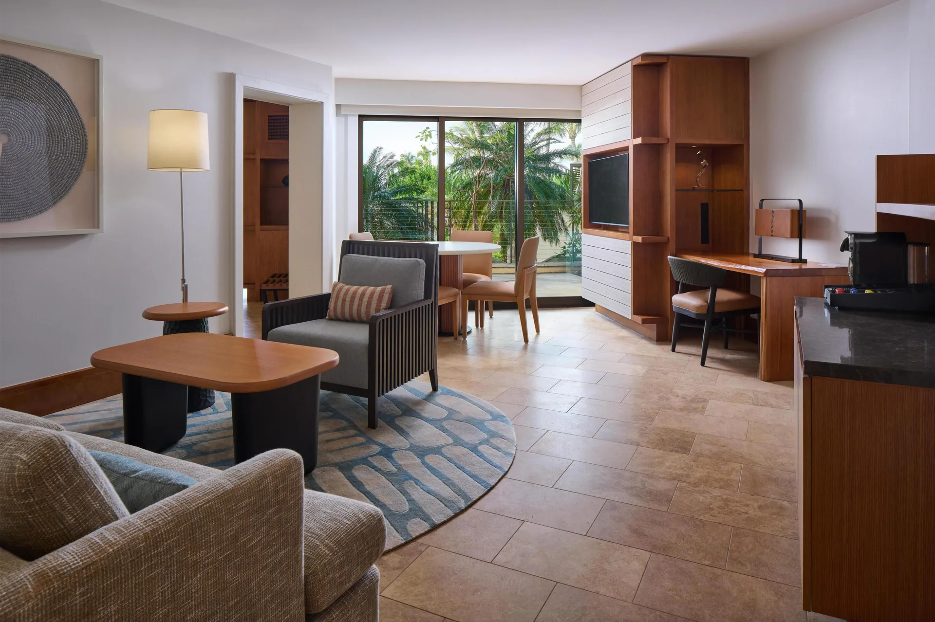 Partial View Suite living area with balcony and desk at Andaz Maui at Wailea Resort.