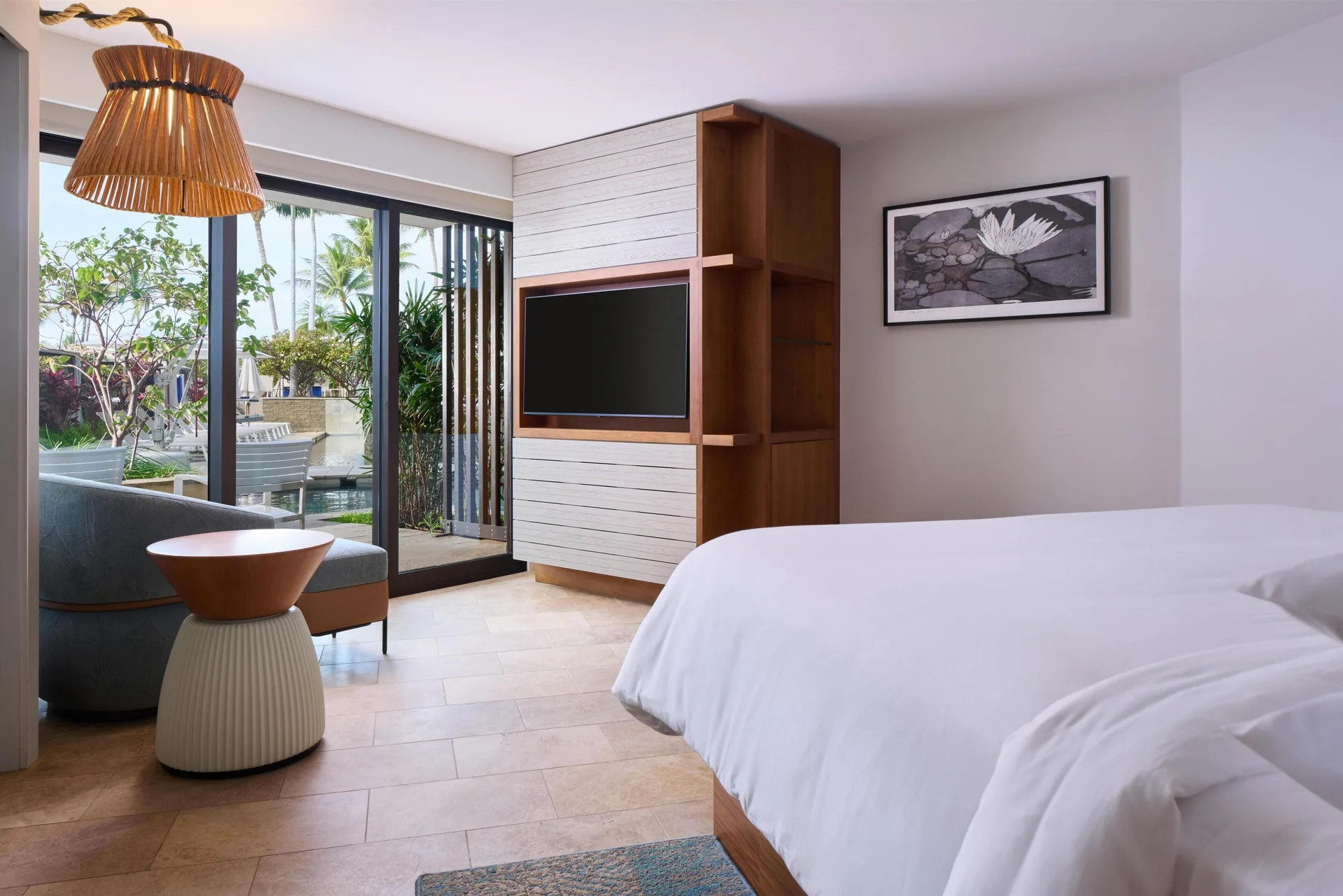 Pool Side Suite bedroom with king bed and patio access at Andaz Maui at Wailea Resort.