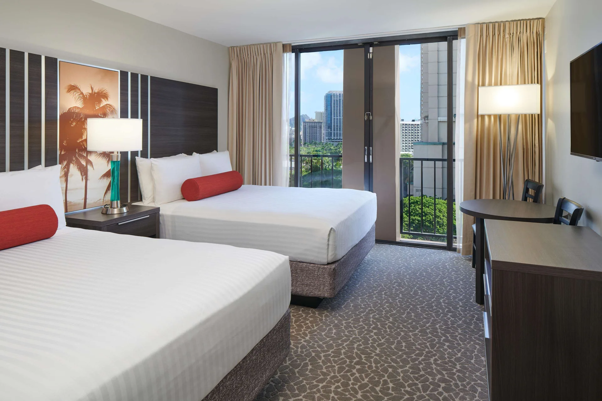 Partial Ocean View room with two beds and balcony at Aqua Palms Waikiki.