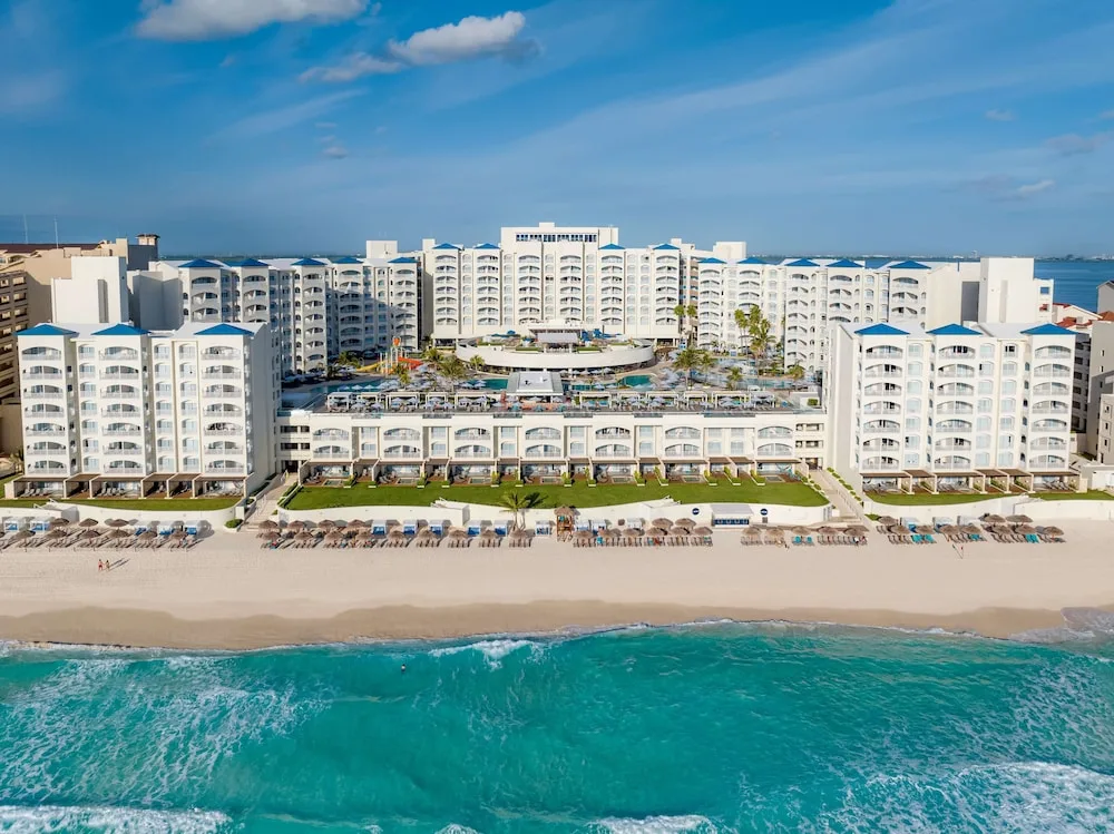 Hilton Cancun Mar Caribe All-Inclusive Resort beachfront property with pools and family amenities in Cancun's Hotel Zone.