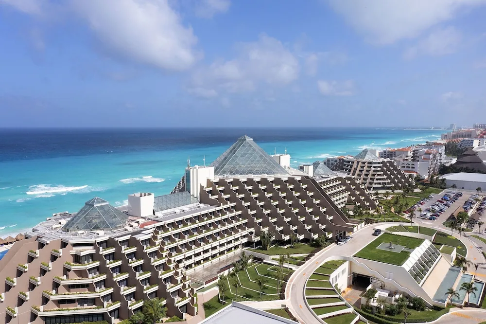 Paradisus Cancún all-inclusive resort with beachfront pools and lush tropical grounds in Cancun's Hotel Zone.