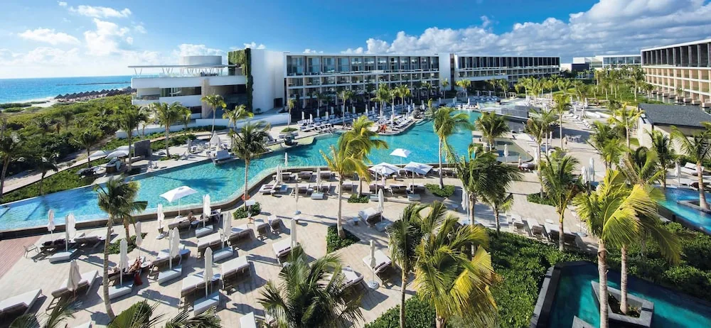 TRS Coral Hotel adults-only all-inclusive resort in Costa Mujeres with infinity pools, modern suites, and beachfront luxury.