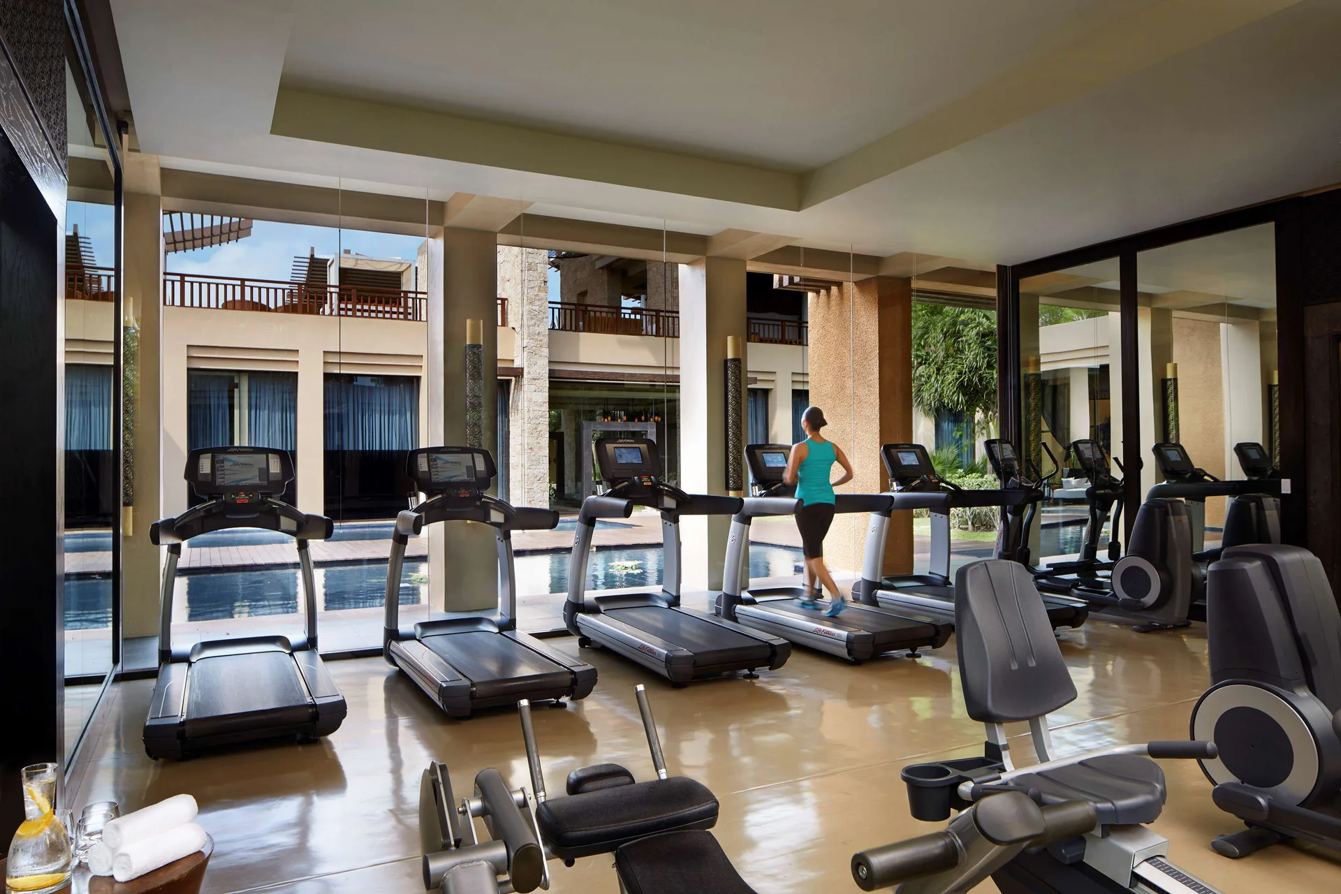 Fitness room with treadmills and pool views at Banyan Tree Mayakoba.