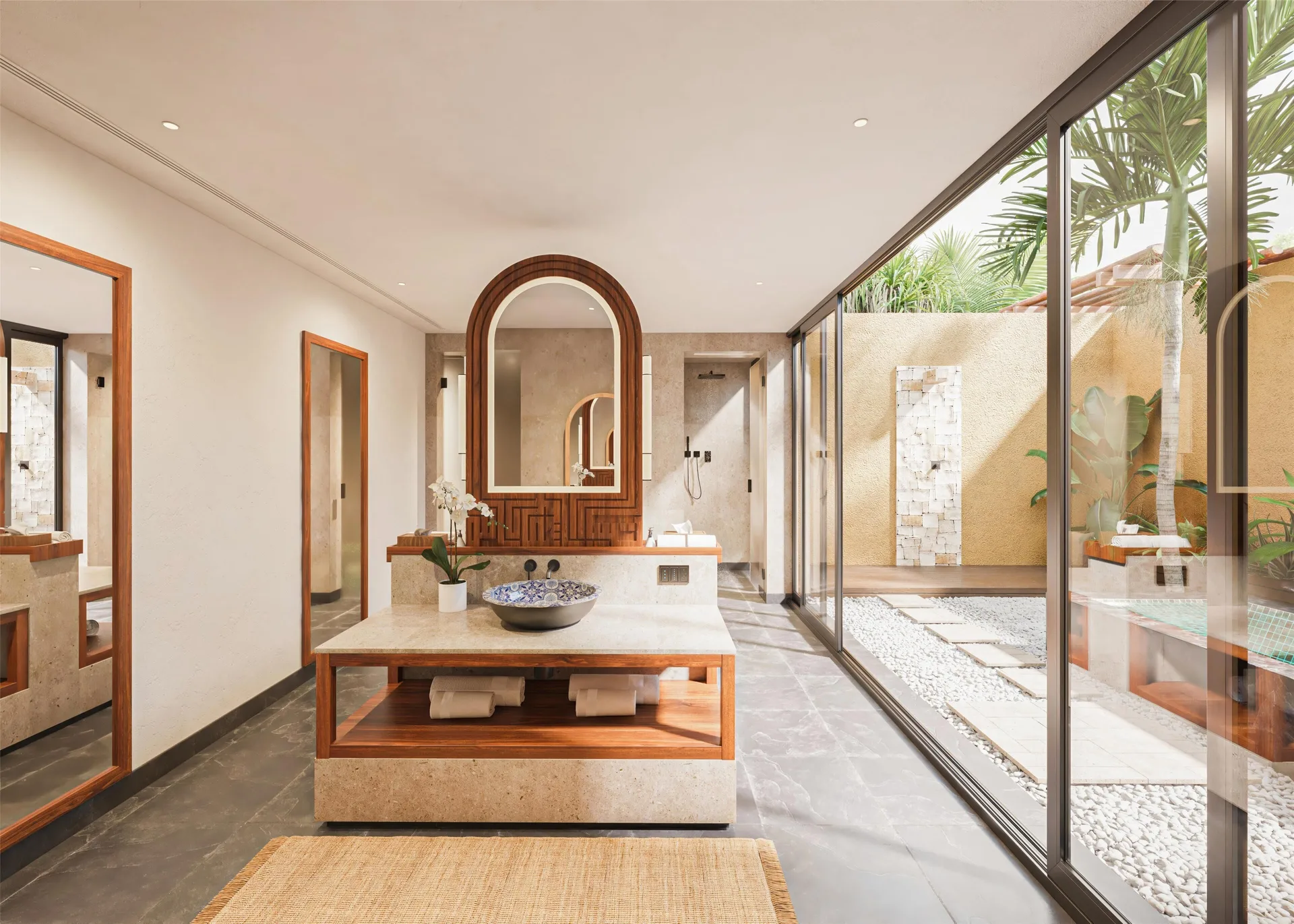 Bathroom vanity and garden-facing glass wall at Banyan Tree Mayakoba's Harmony Two-Bedroom Lagoon Pool Villa.