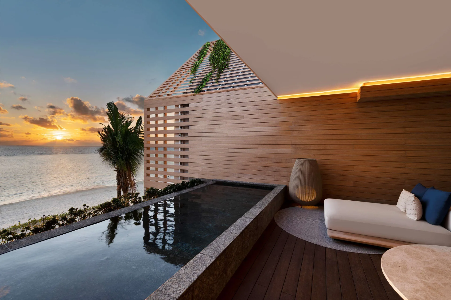 Oceanfront Balcony Pool Suite terrace pool at sunset at Banyan Tree Mayakoba.