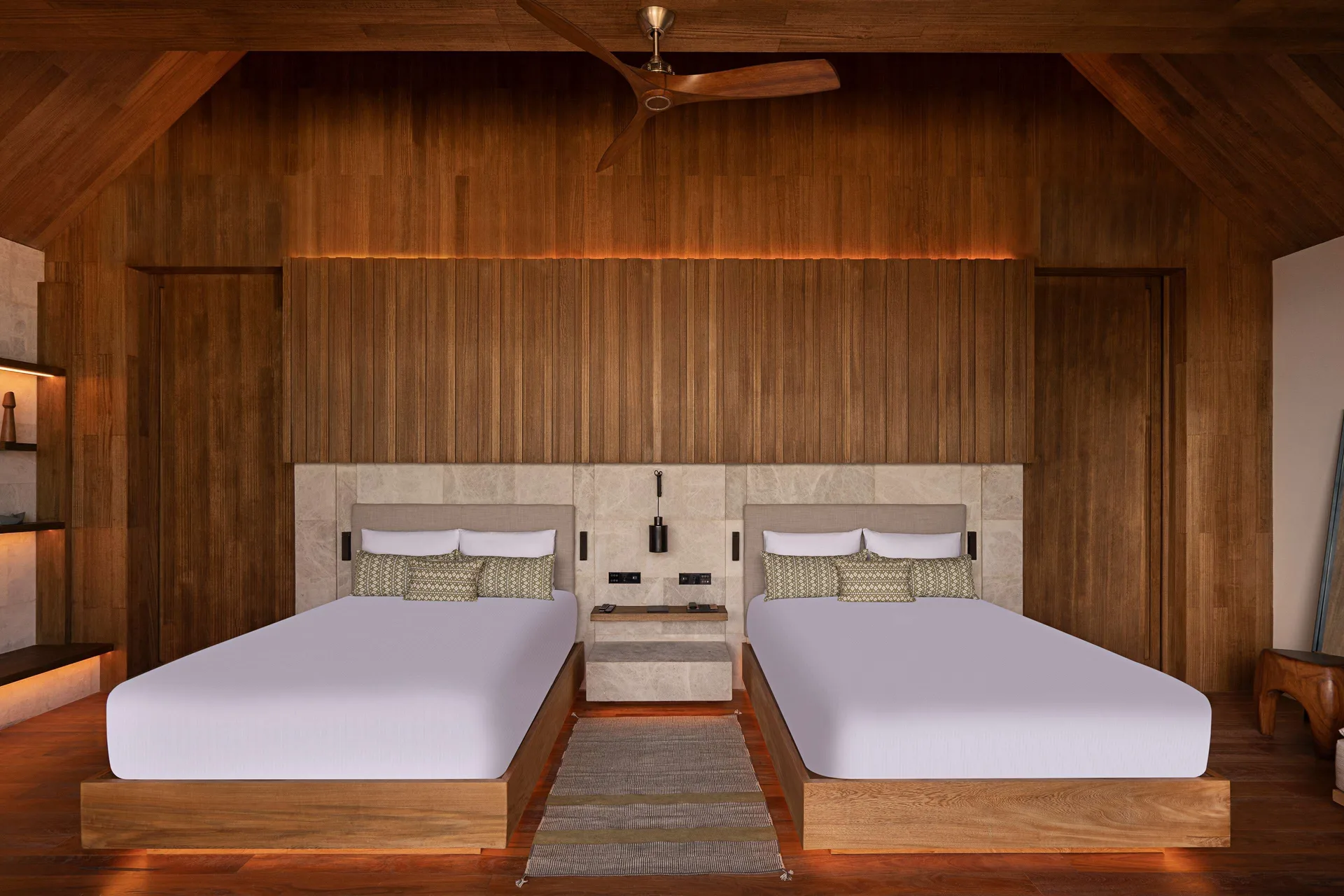 Oceanfront Veranda Pool Suite two-bed room with vaulted wood ceiling at Banyan Tree Mayakoba.
