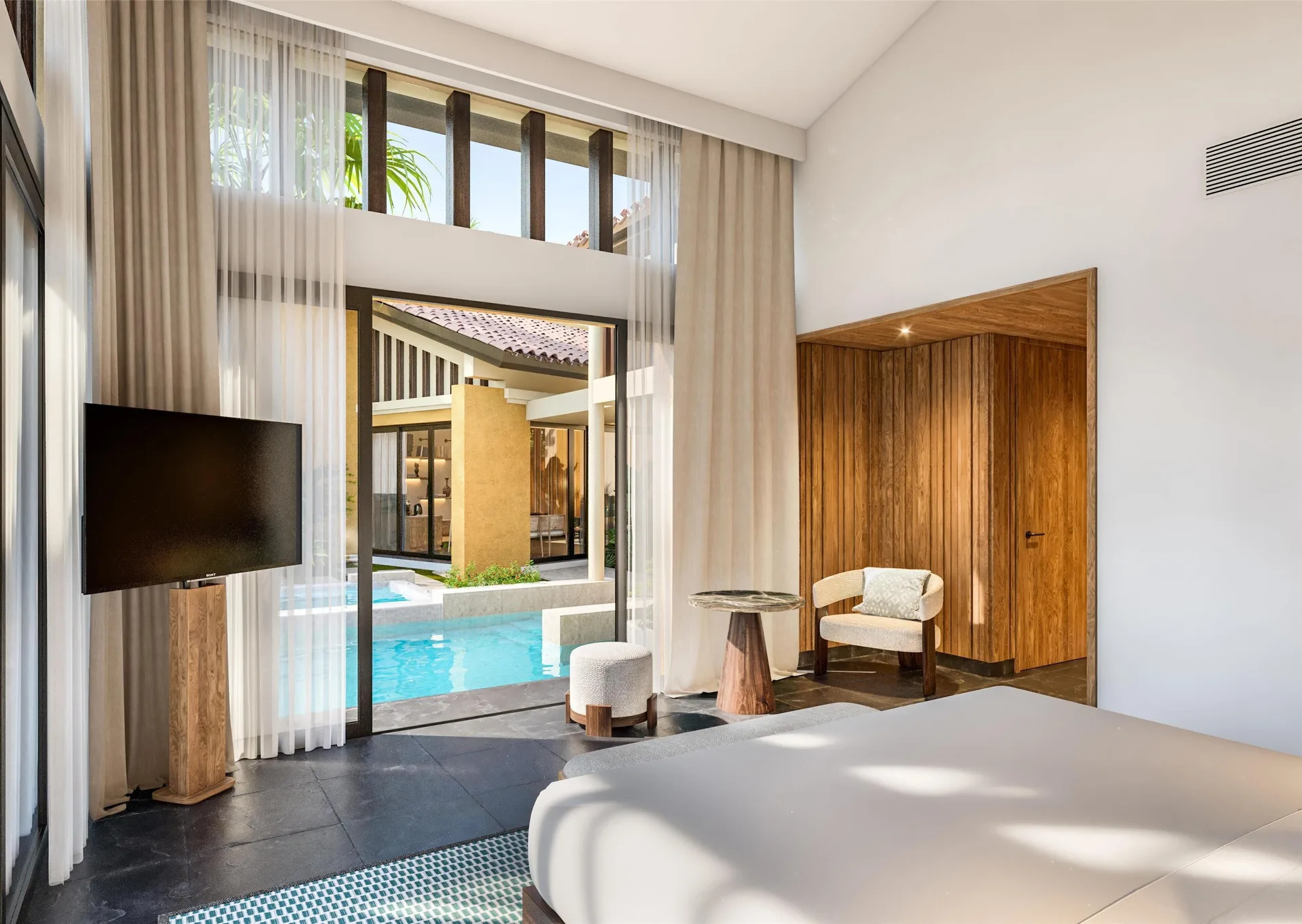 Serenity Pool Villa bedroom with pool view at Banyan Tree Mayakoba.