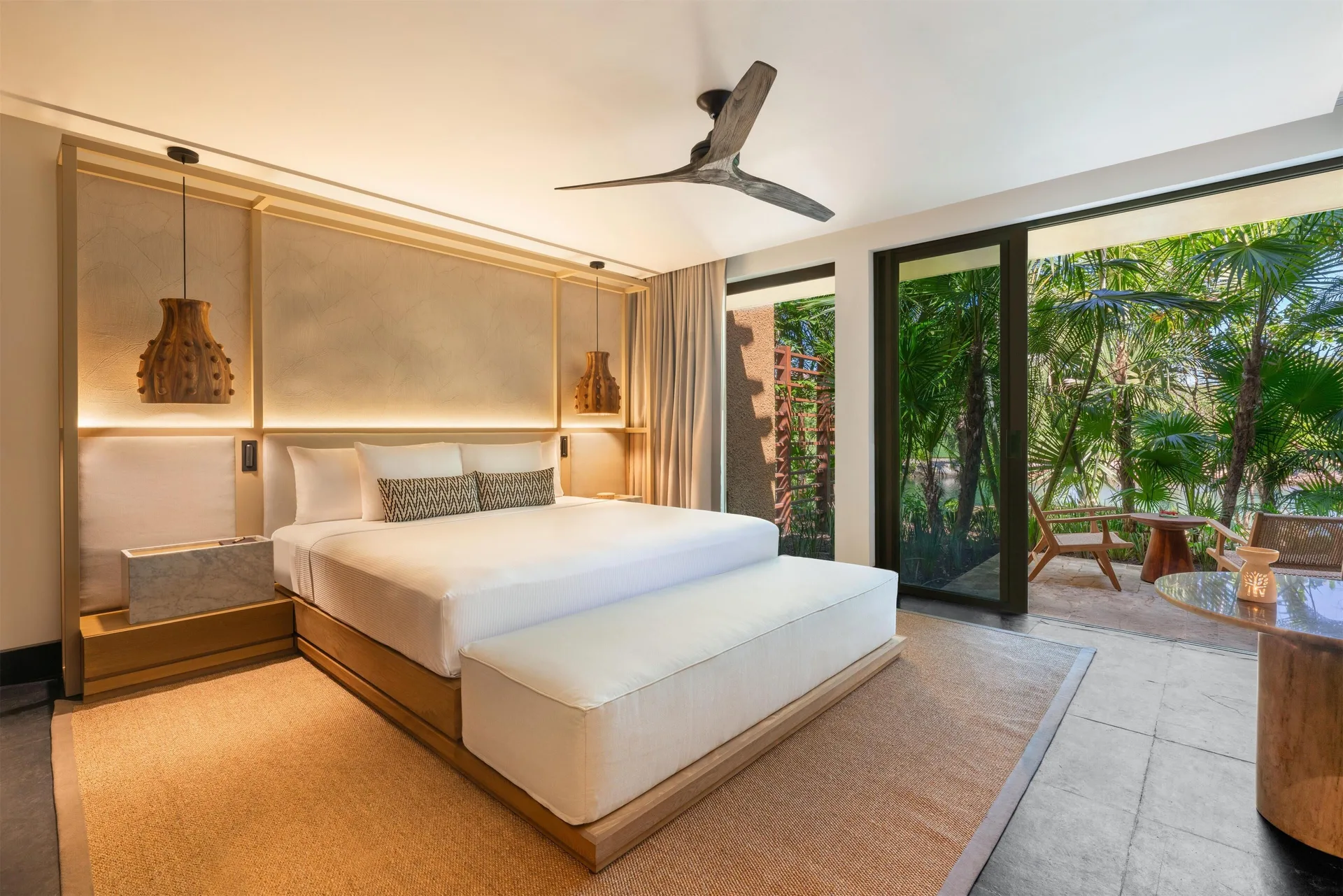 Three-Bedroom Family Residence king bedroom with patio view at Banyan Tree Mayakoba.