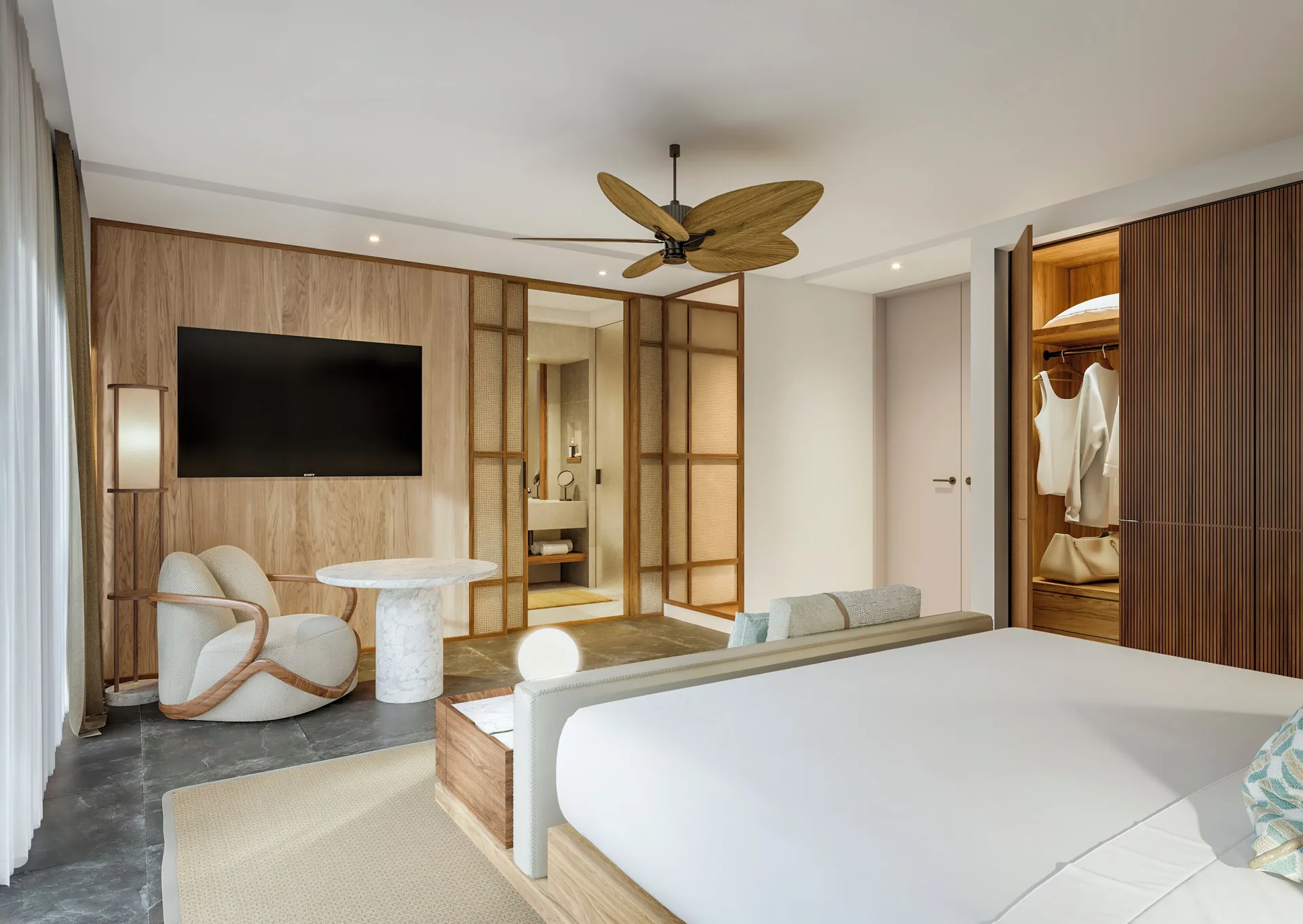 Three-Bedroom Family Residence king bedroom with seating at Banyan Tree Mayakoba.