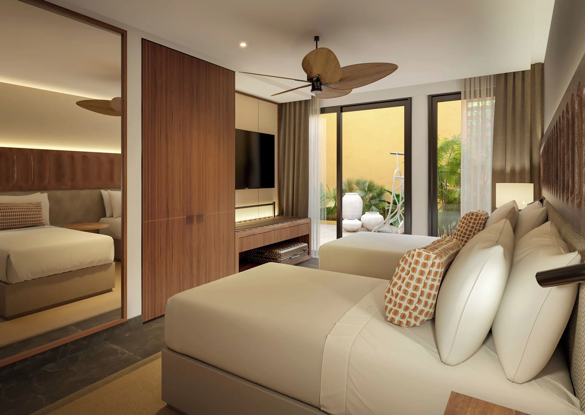 Three-Bedroom Family Residence twin bedroom with TV wall at Banyan Tree Mayakoba.