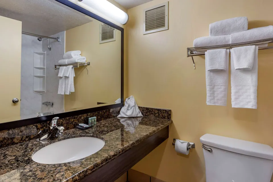 Standard room bathroom vanity and towels at Best Western The Plaza Hotel Honolulu Airport.