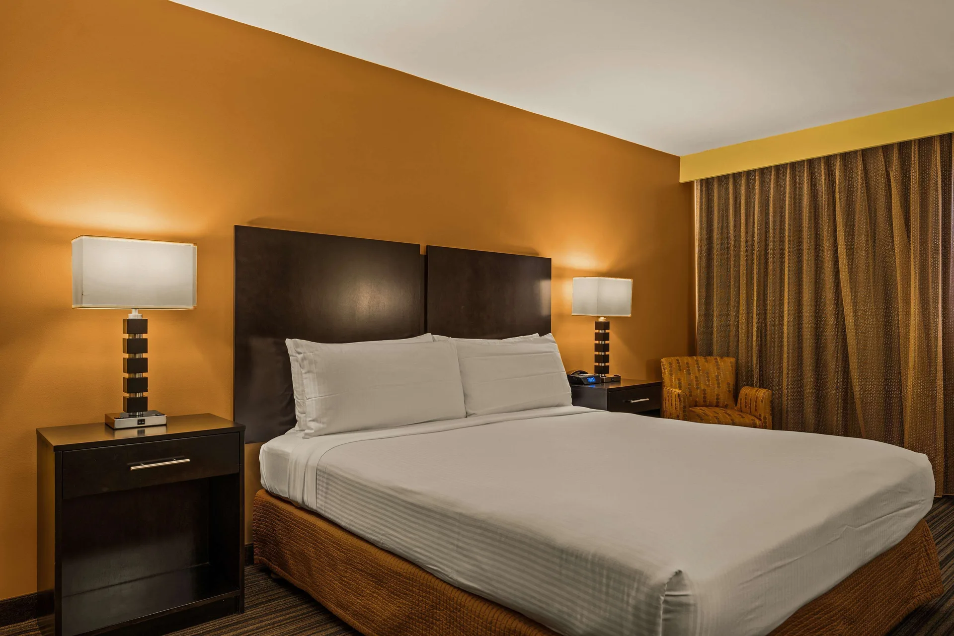 Standard room king bed with nightstands at Best Western The Plaza Hotel Honolulu Airport.