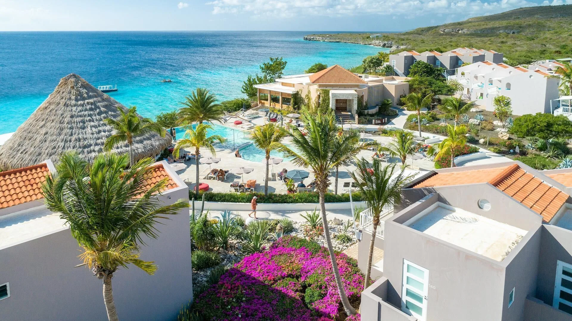 Coral Estate Luxury Resort clifftop coastal resort with ocean views, villas, and relaxed beach club atmosphere