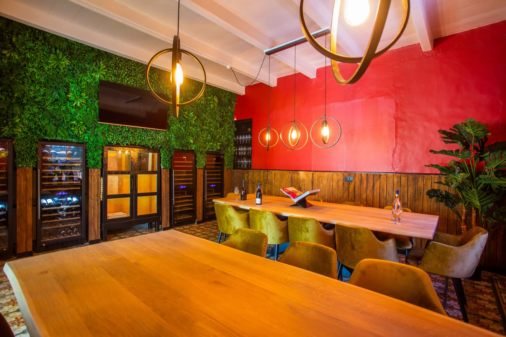 Private dining room with wine coolers and pendant lights at Blue Bay Curacao Golf & Beach Resort.