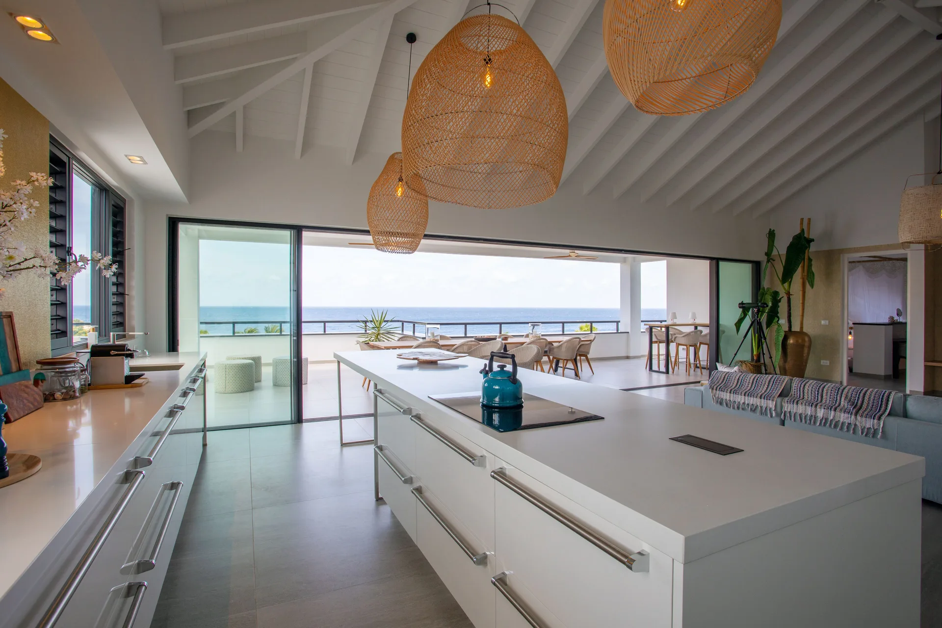 Open penthouse kitchen and terrace facing the ocean at Blue Bay Curacao Golf & Beach Resort.