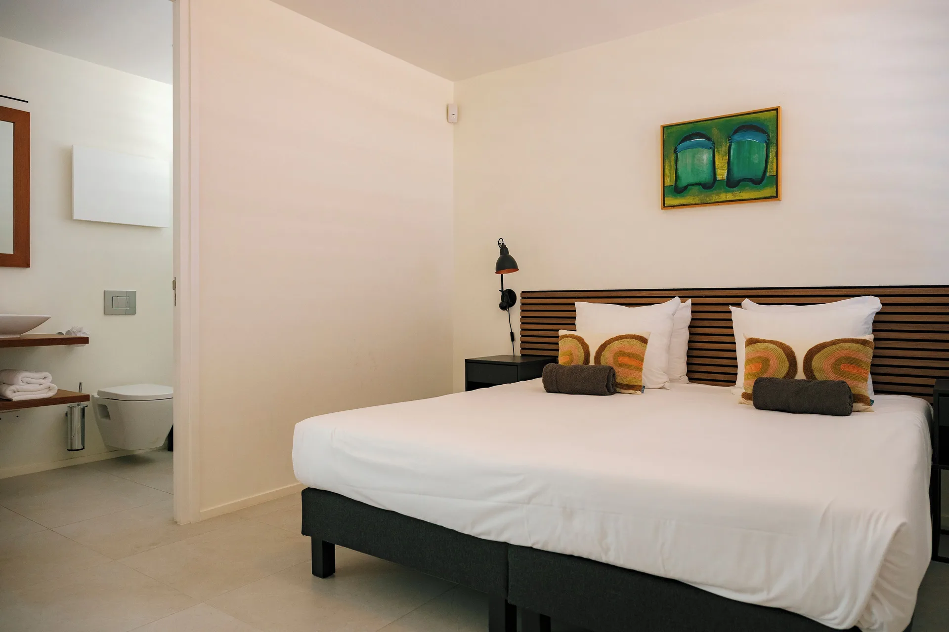 Deluxe Villa bedroom and open bathroom at Blue Bay Curacao Golf & Beach Resort.