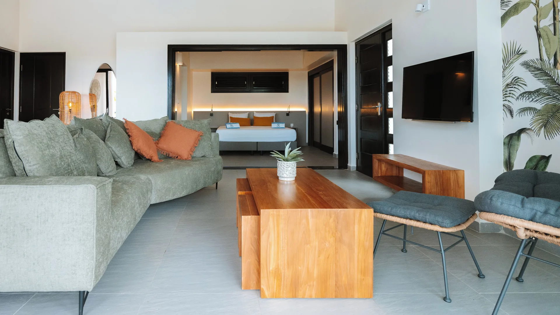 Garden Apartment 2 Bedroom living room with bedroom beyond at Blue Bay Curacao Golf & Beach Resort.