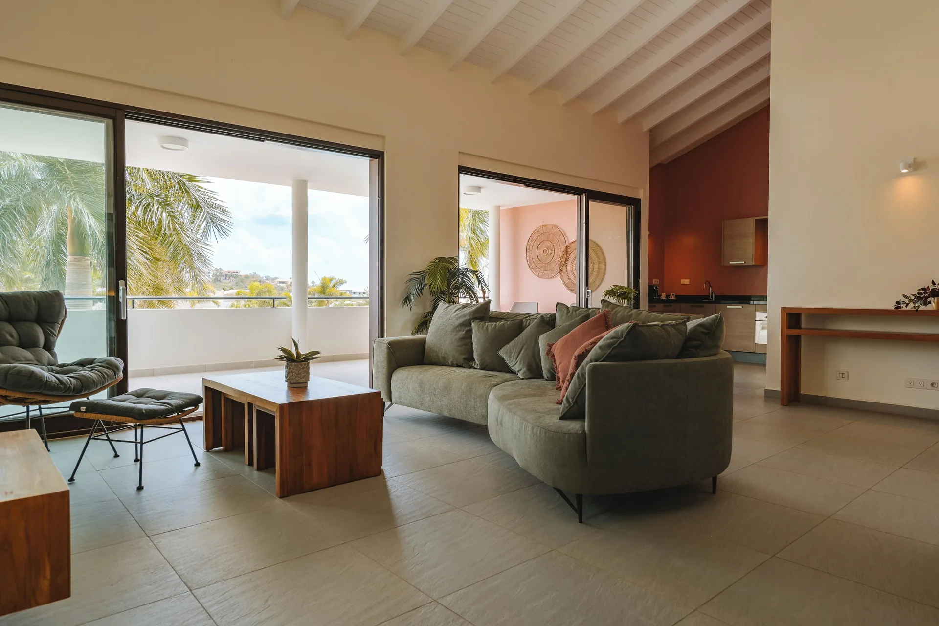 Garden Apartment 2 Bedroom lounge with balcony doors at Blue Bay Curacao Golf & Beach Resort.