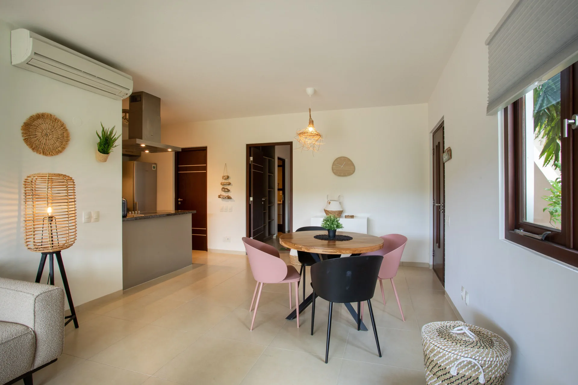 Greenview 2-bedroom Apartment dining area at Blue Bay Curacao Golf & Beach Resort with kitchen counter nearby.