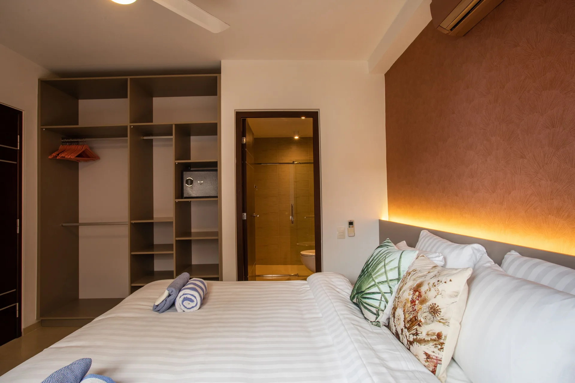 King bed in a Greenview apartment at Blue Bay Curacao Golf & Beach Resort with bathroom and closet visible.