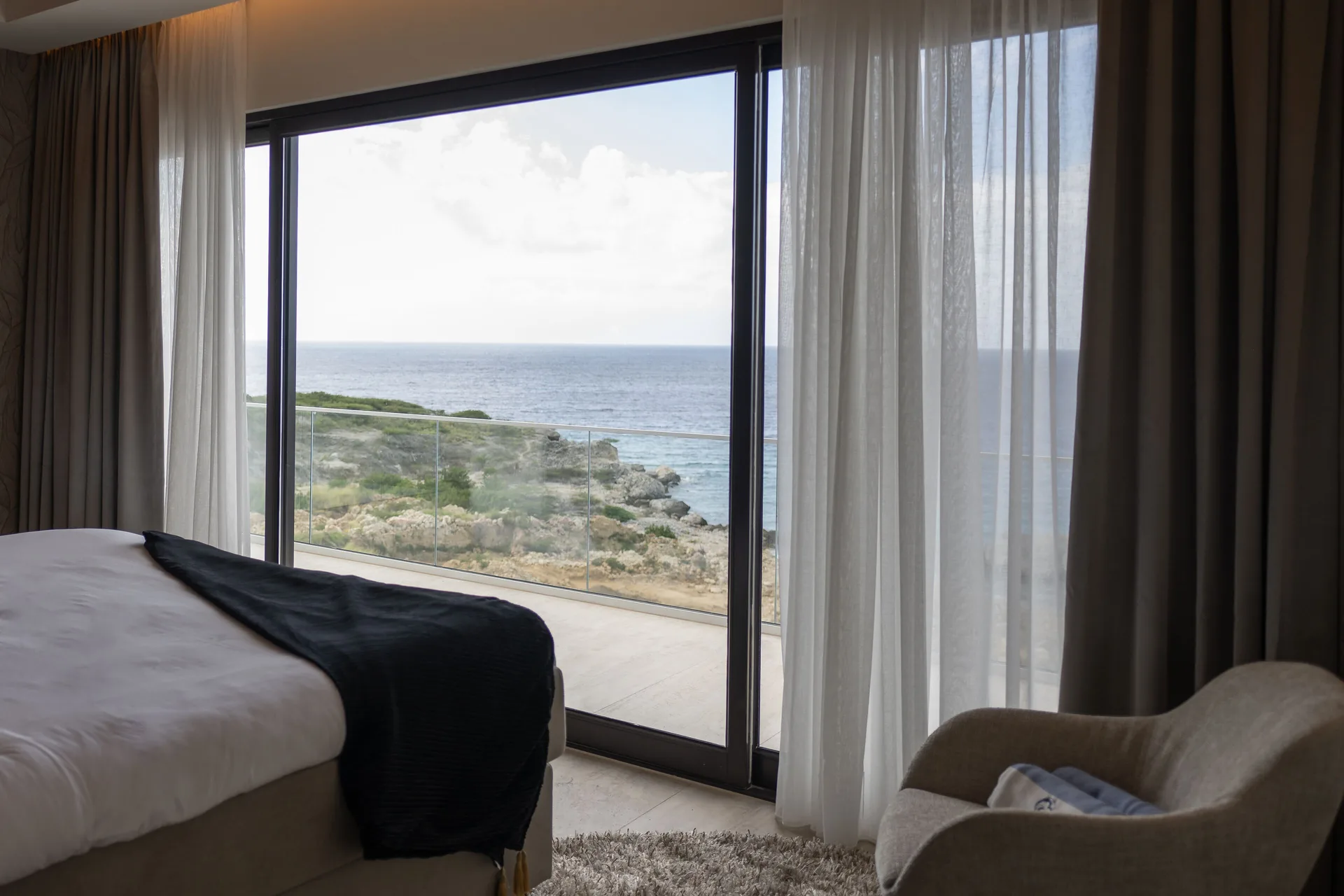 Luxury Penthouse Ocean View bedroom terrace view at Blue Bay Curacao Golf & Beach Resort.
