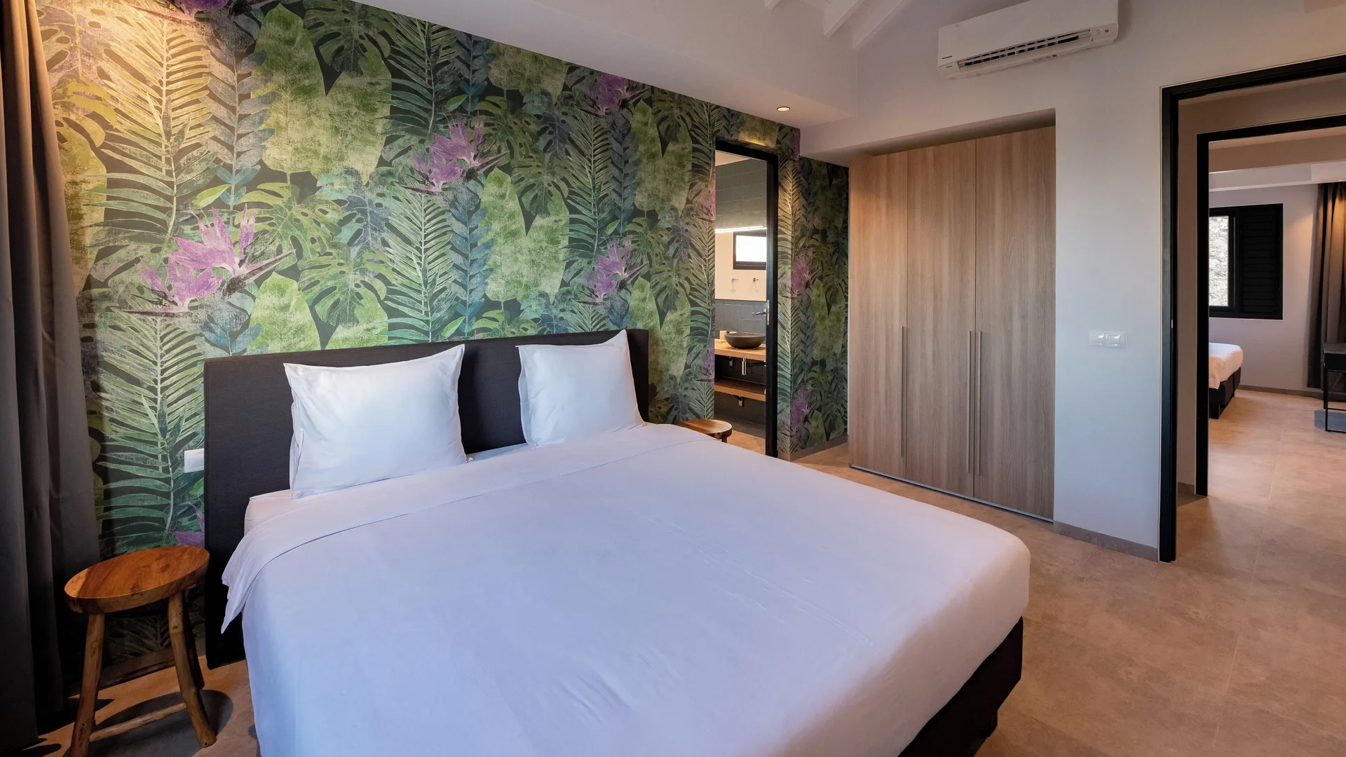 Luxury villa bedroom with king bed at Blue Bay Curacao Golf & Beach Resort.
