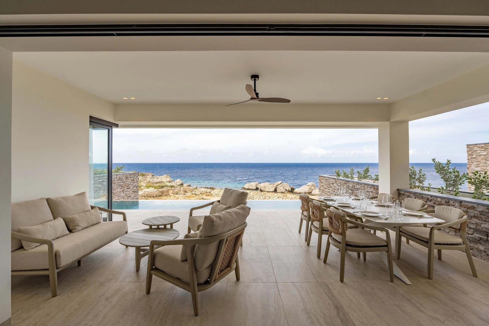 Oceanfront terrace of the 2 Bedroom Apartment at Blue Bay Curacao Golf & Beach Resort.