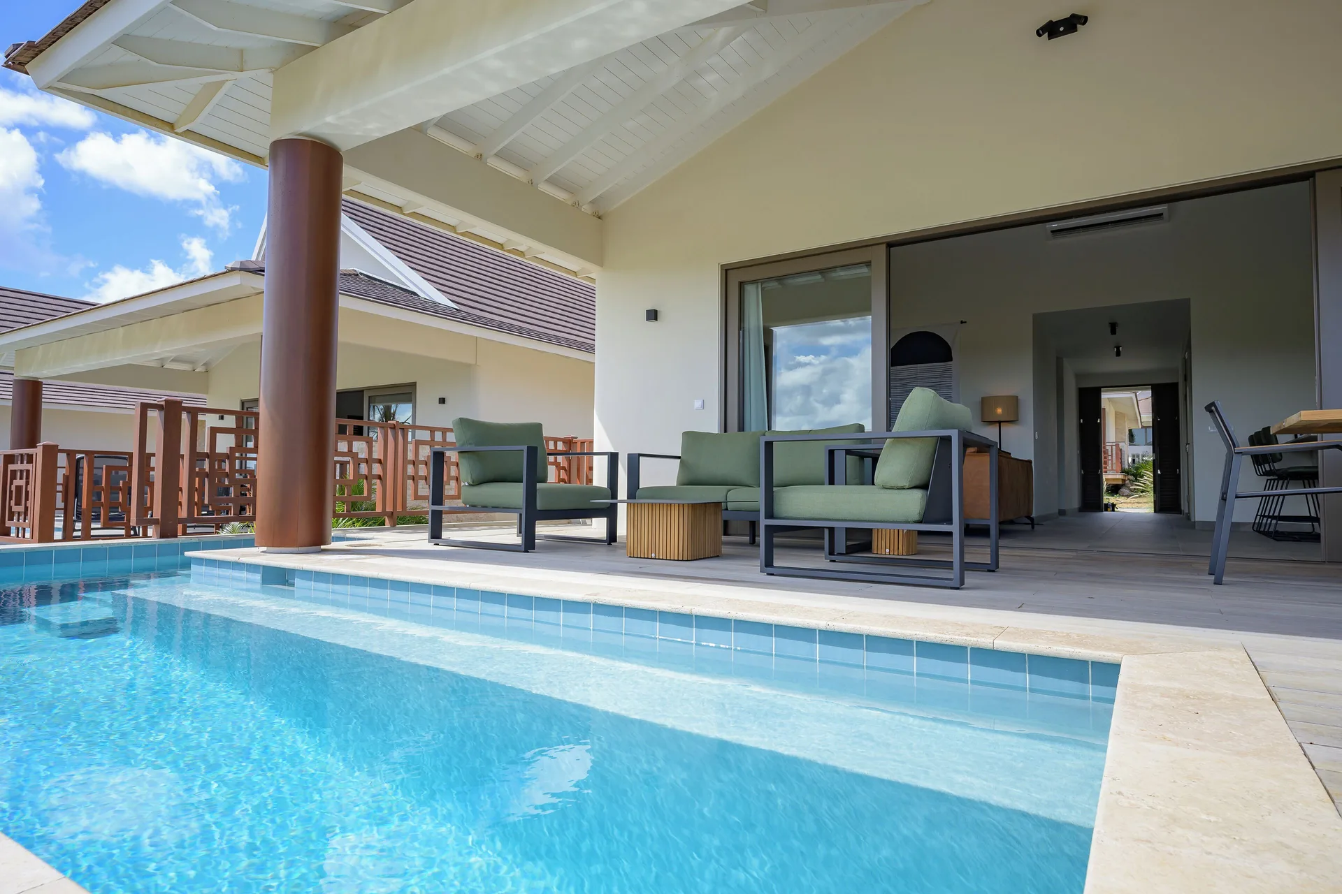 Private Pool Villa pool terrace with outdoor seating at Blue Bay Curacao Golf & Beach Resort.