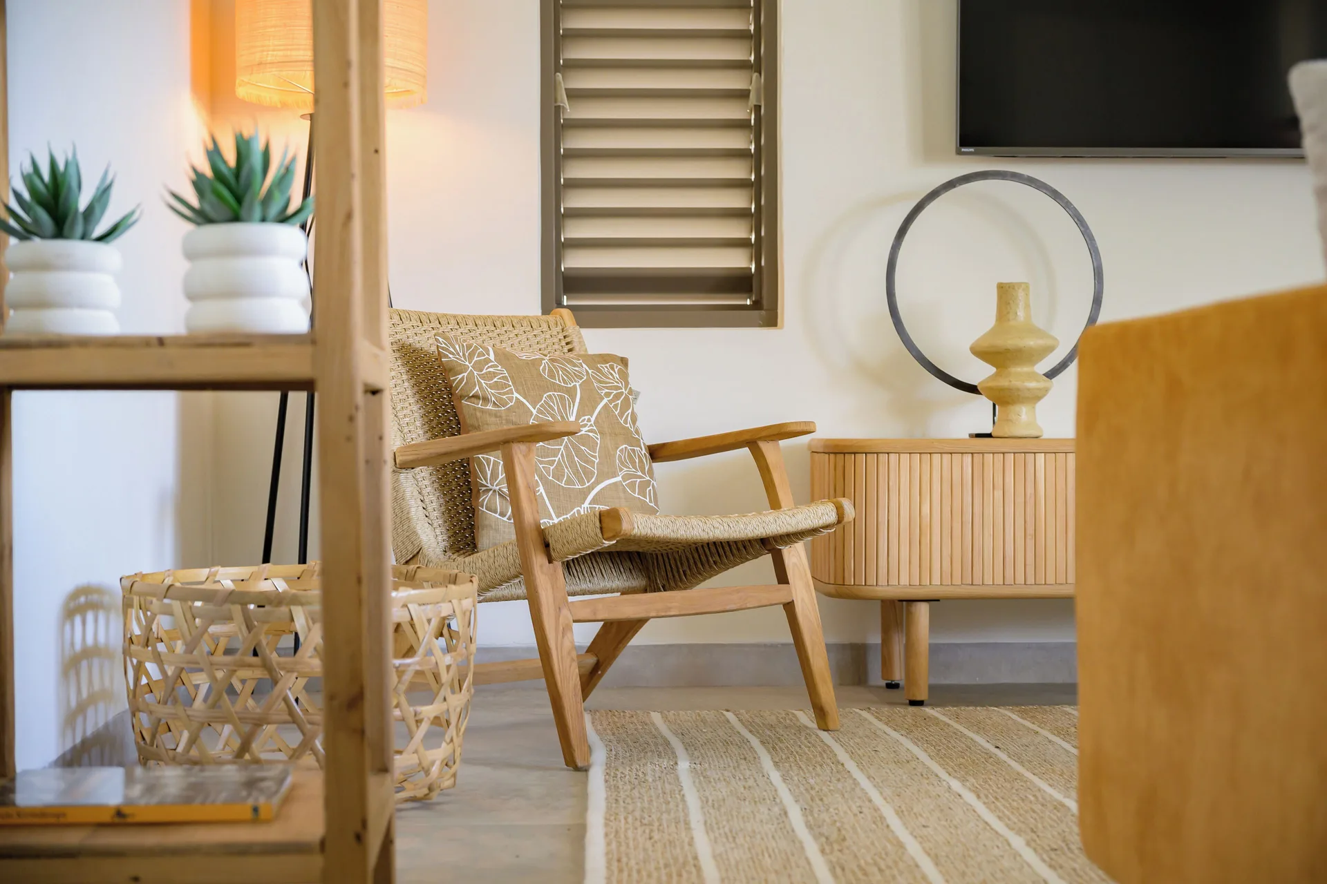 Private Pool Villa sitting corner with woven chair at Blue Bay Curacao Golf & Beach Resort.