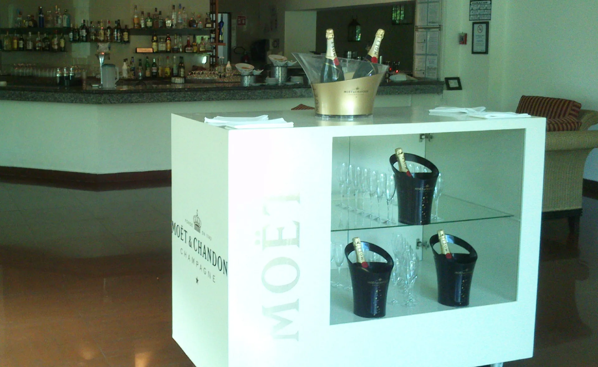 Lobby bar display with chilled sparkling wine and glassware at BlueBay Grand Esmeralda.