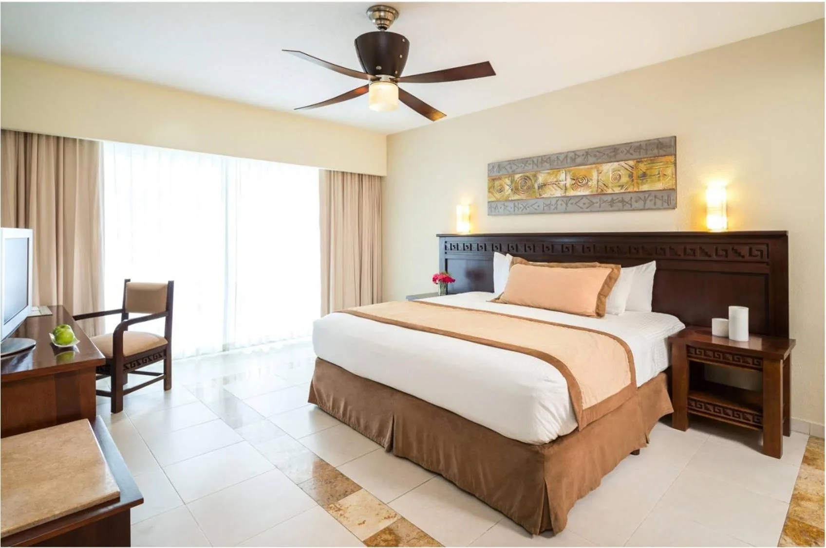 Deluxe Garden View room with king bed and bright window at BlueBay Grand Esmeralda.